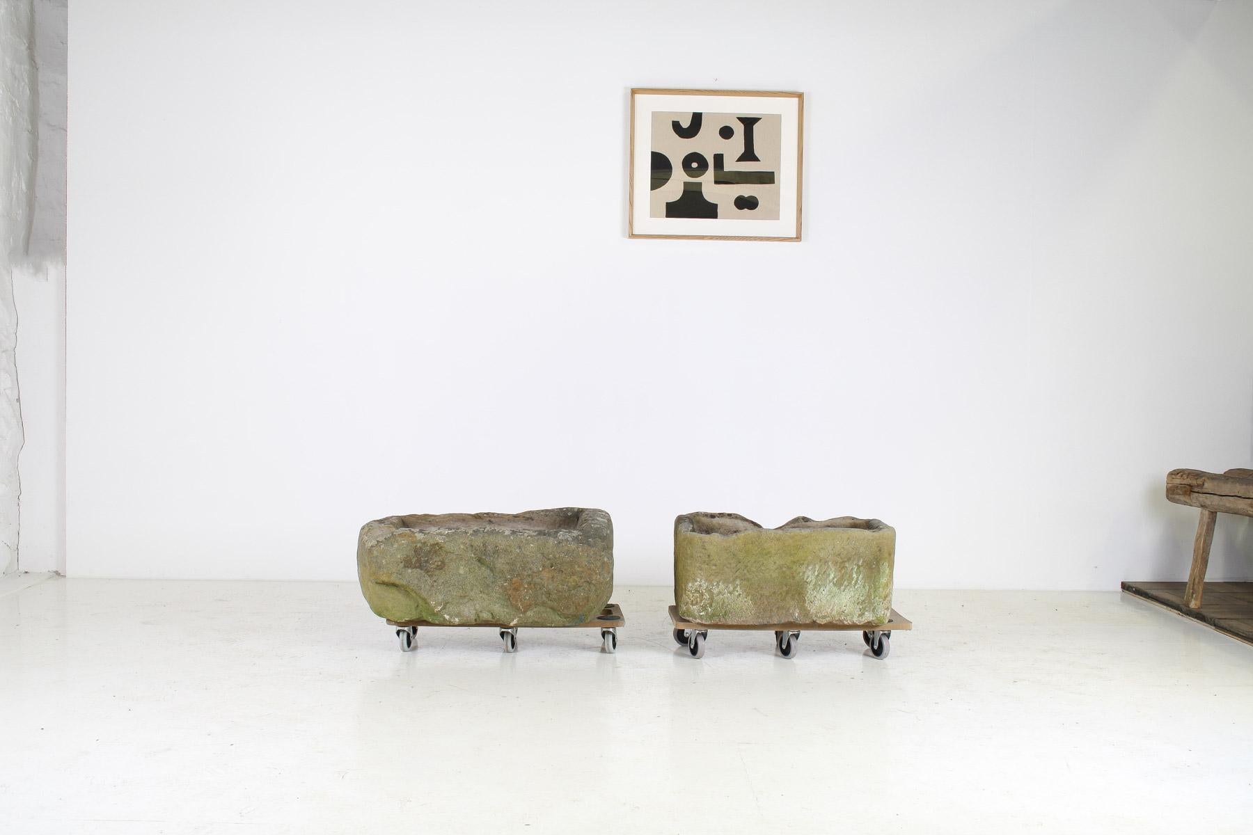 These antique sandstone rectangular trough garden planters are truly stunning. Their weathered patina adds character and charm, making them perfect focal points in any garden. The natural shapes of the stone evoke a sense of timelessness and