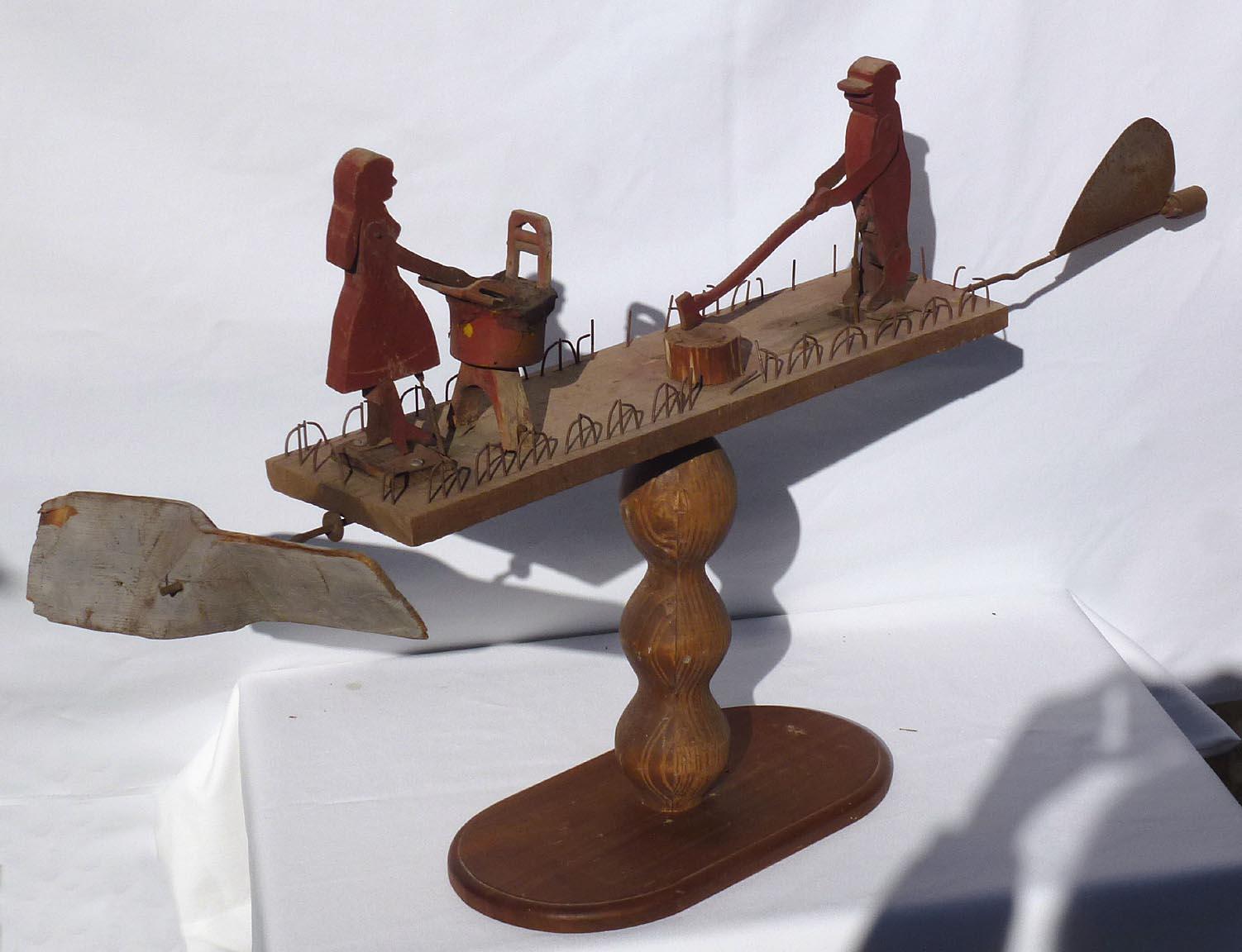 American Primitive Whirligig with a Man Chopping Wood and a Woman Scrubbing Laundry For Sale