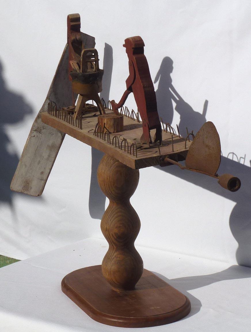Hand-Crafted Primitive Whirligig with a Man Chopping Wood and a Woman Scrubbing Laundry For Sale