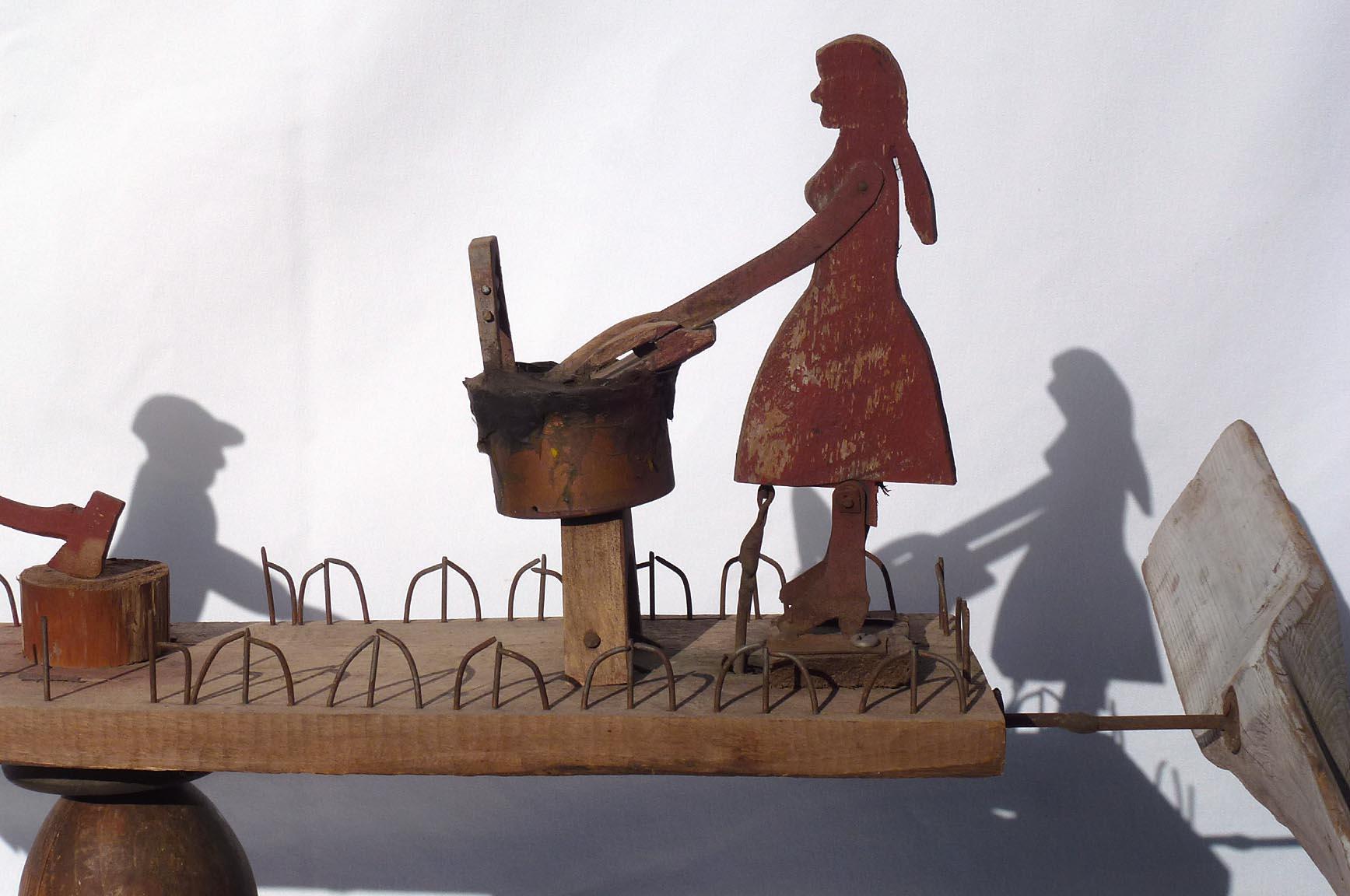 Primitive Whirligig with a Man Chopping Wood and a Woman Scrubbing Laundry In Good Condition For Sale In Fort Payne, AL