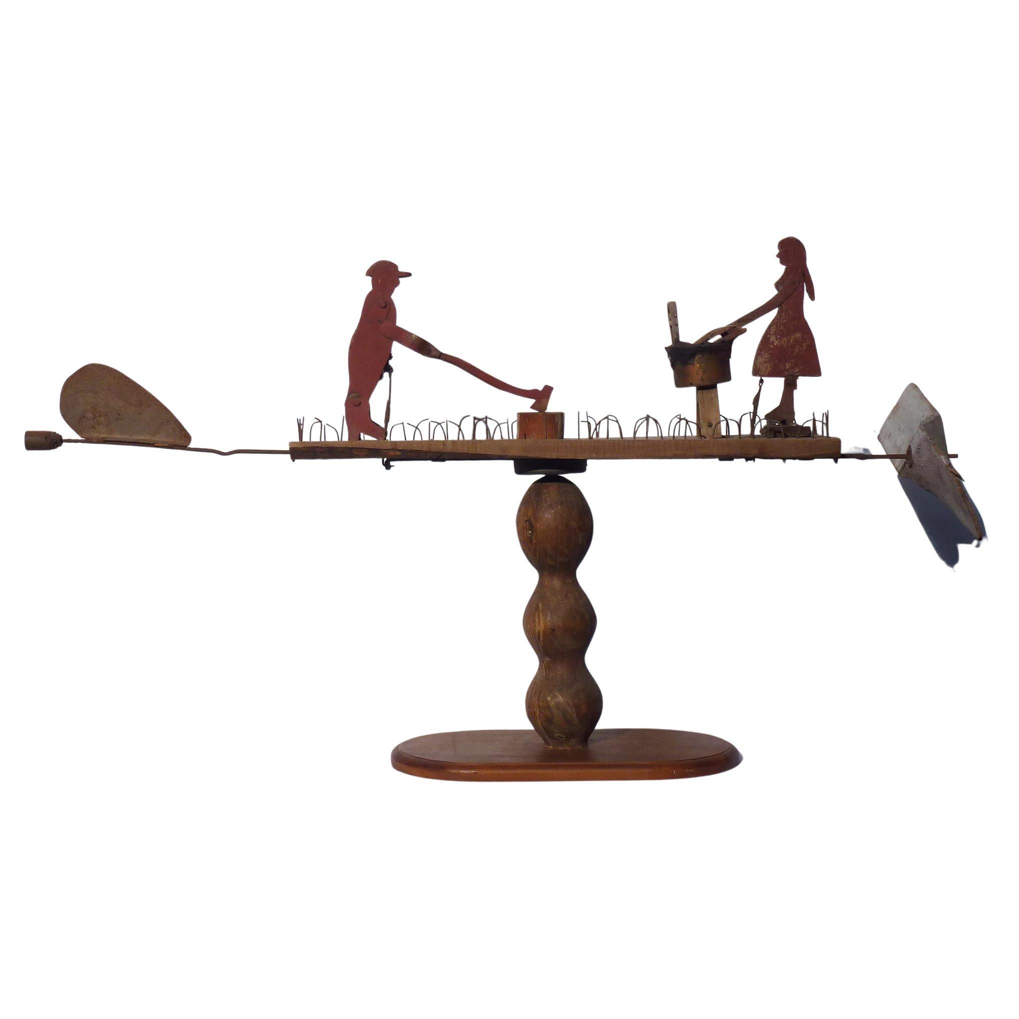 Primitive Whirligig with a Man Chopping Wood and a Woman Scrubbing Laundry For Sale