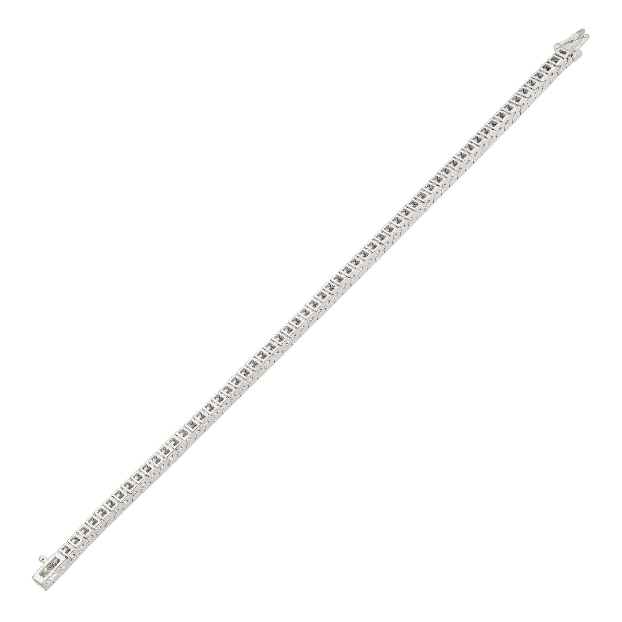 A princess cut diamond line bracelet, the sixty-three princess-cut diamonds, estimated to weigh 6.3 carats in total, assessed to be of F-G colour and VS clarity, channel-set in 14ct white gold mount, hallmarked 14ct gold, London, 2020, bearing the