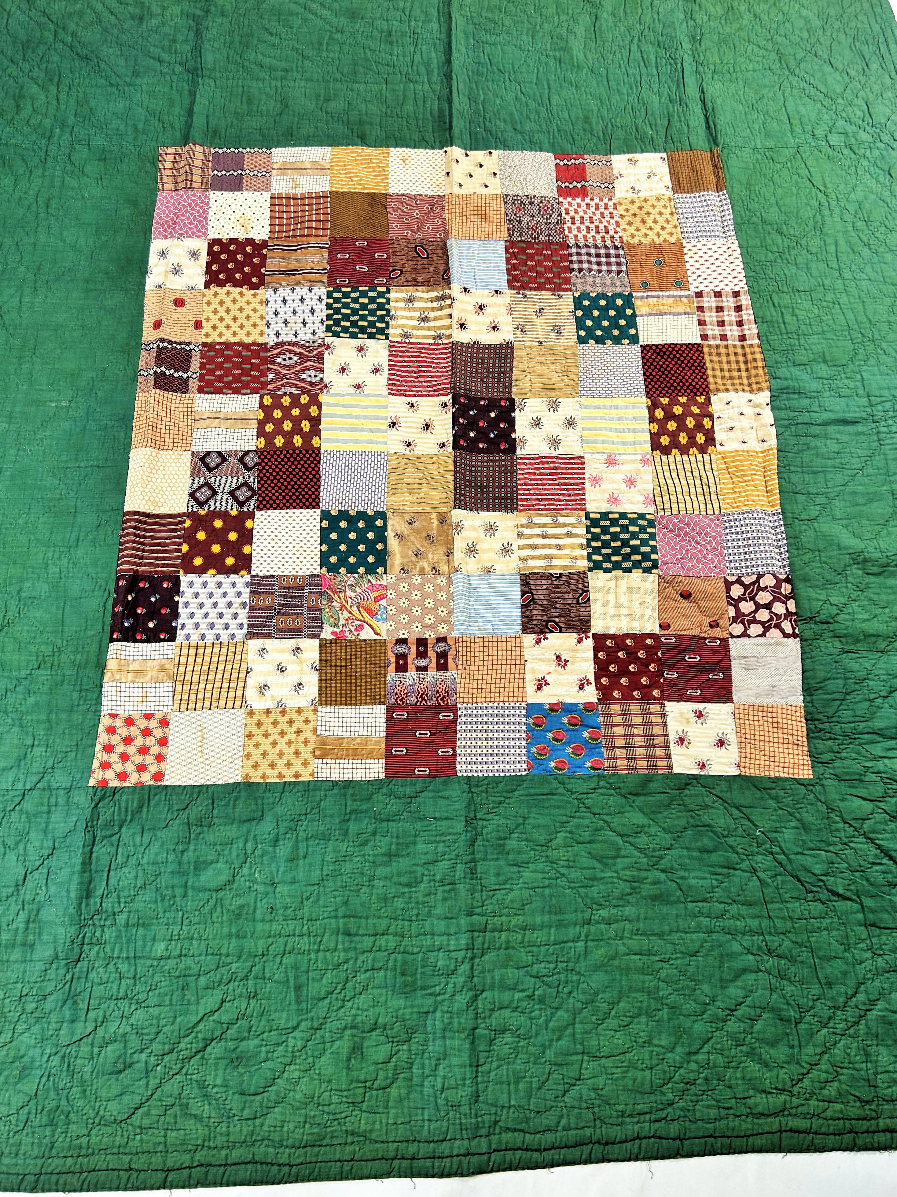 Circa 1860
Provence
A printed cotton patchwork extracted from a Provençal Courtepointe which has been unquilted and dates from the French Second Empire period. Patchwork of 110 squares of printed cotton alternating polka dots, stripes, flowers and
