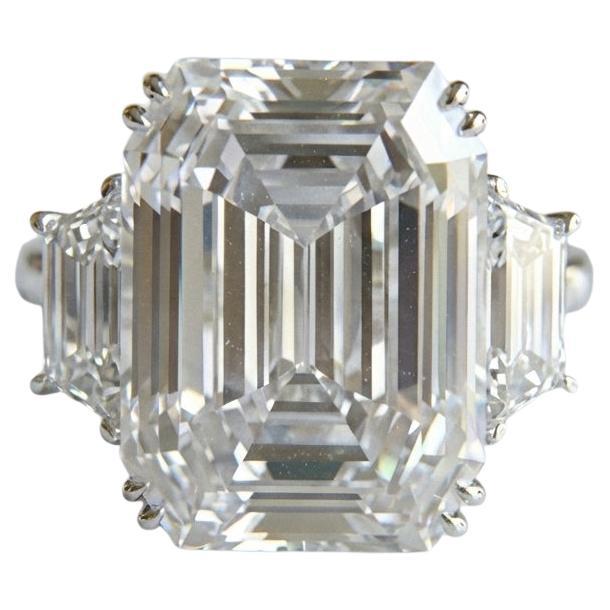 A Promise in Platinum: 9.13ct G/VS1 Emerald Cut Embraced by Trapezoids For Sale