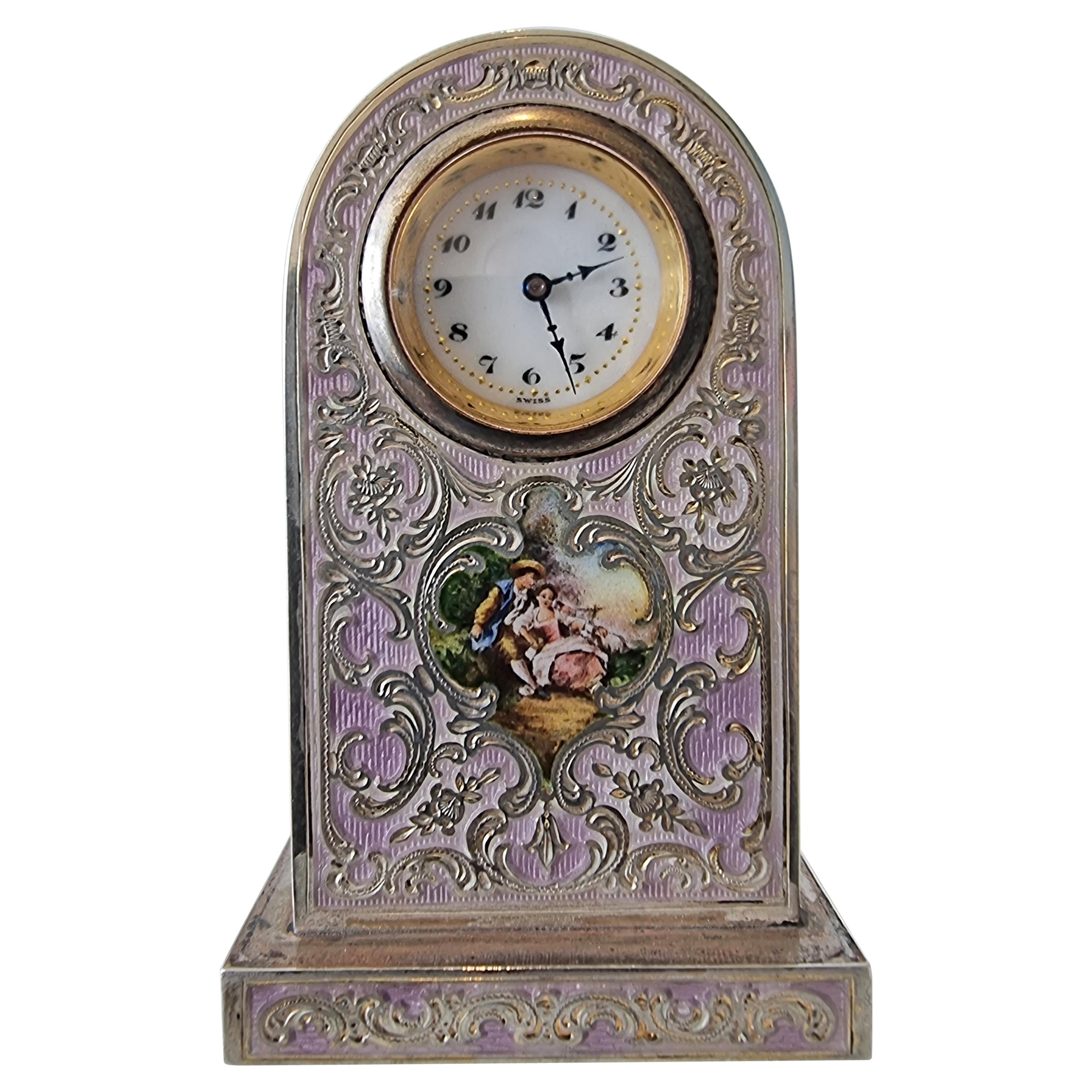 A Purple Guilloche Enamel Clock with decorative inlay and hand painted picture