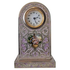 A Purple Guilloche Enamel Clock with decorative inlay and hand painted picture