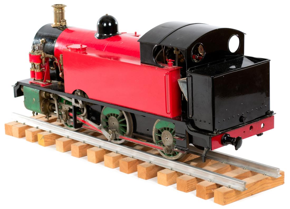Designed by Curly Lawrence (i.s. LBSC), the prolific and highly-respected designer. With copper boiler and casting with 3.5-inch guage, made in England and painted black, red, and green with working gears and no missing parts,

circa