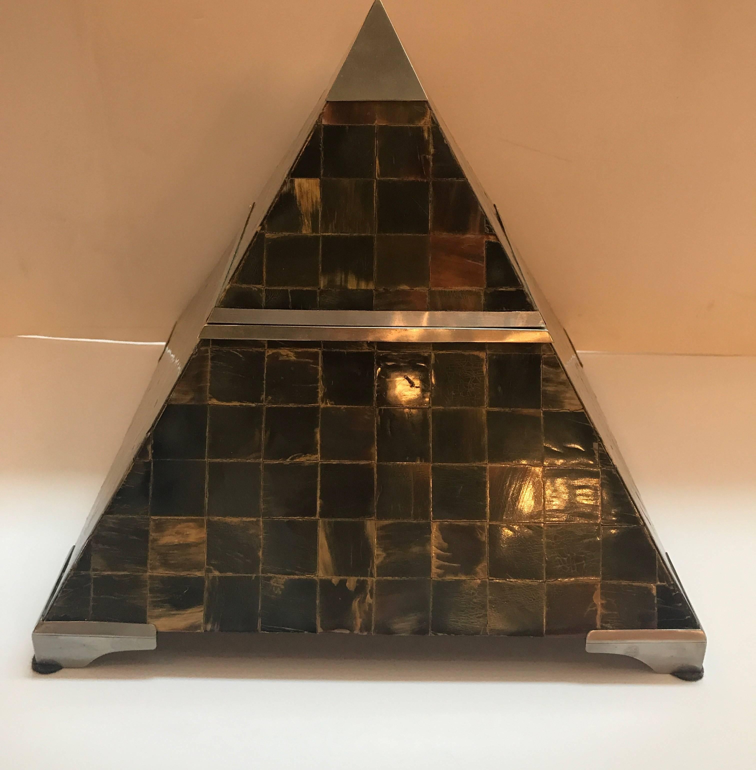A handsome pyramid form hinged box. The exterior in a tiled horn surface with steel mounts.
