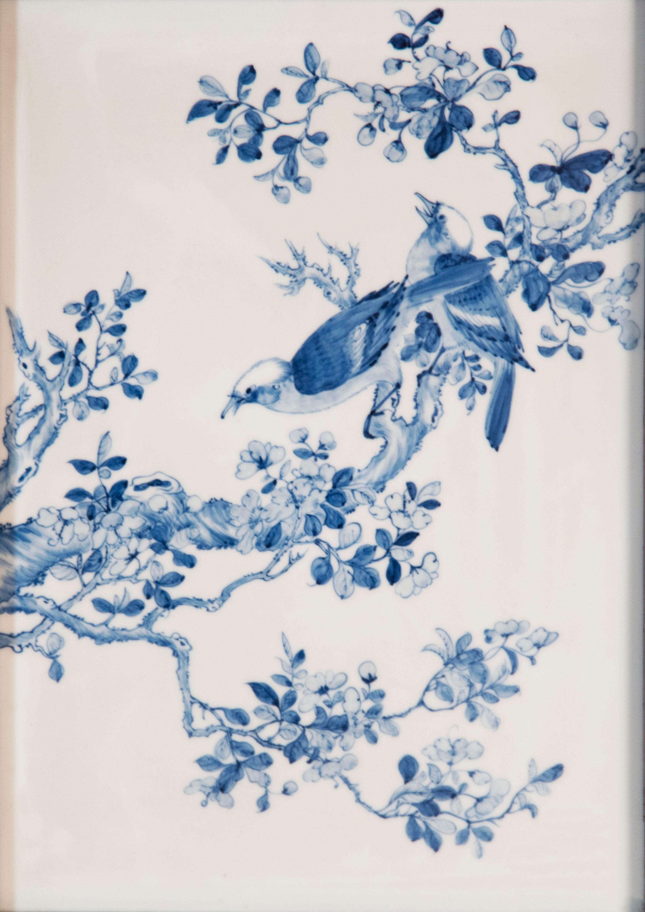 A blue and white porcelain wall plaque from the Qing Dynasty, the last dynasty of Imperial China.

Depicts two birds on a tree branch.

Circa the last quarter of the nineteenth century.
