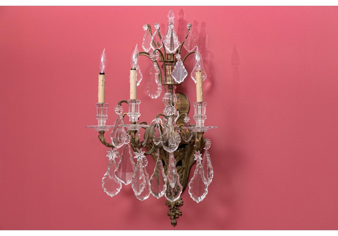 Fine pair of monumental wall sconces. Bronze construction adorned with hand cut European crystal prisms. Heavy and very good  quality, probably made 1920 or earlier.

Dimensions: 30