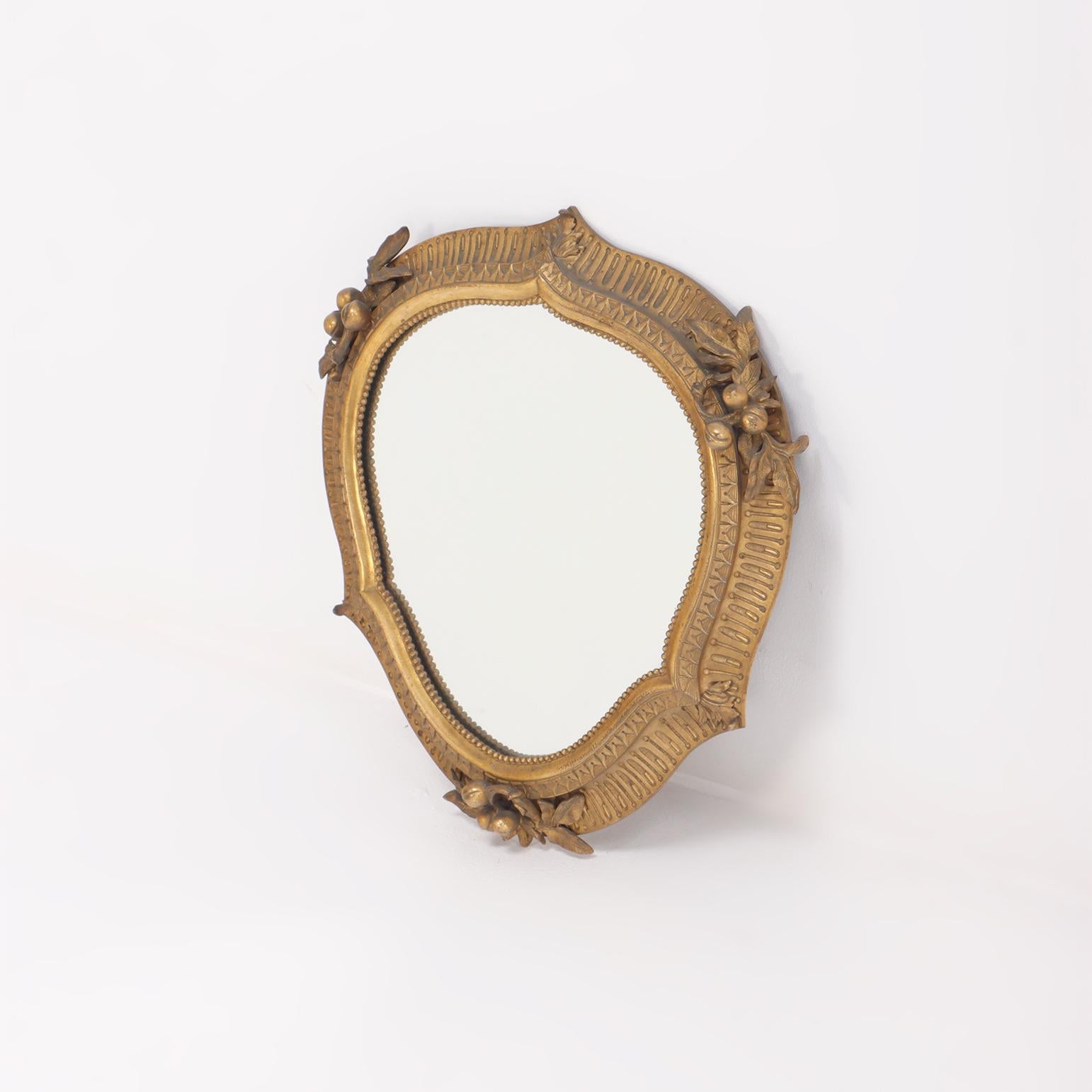 Cast A quality cast bronze French wall mirror with nicely detailed border circa 1900.