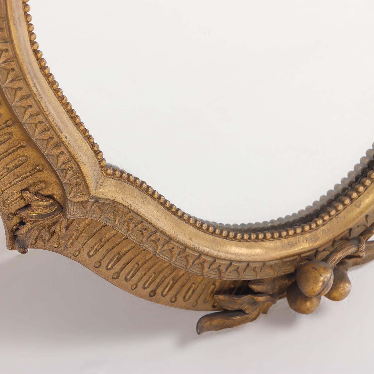 A quality cast bronze French wall mirror with nicely detailed border circa 1900. 1
