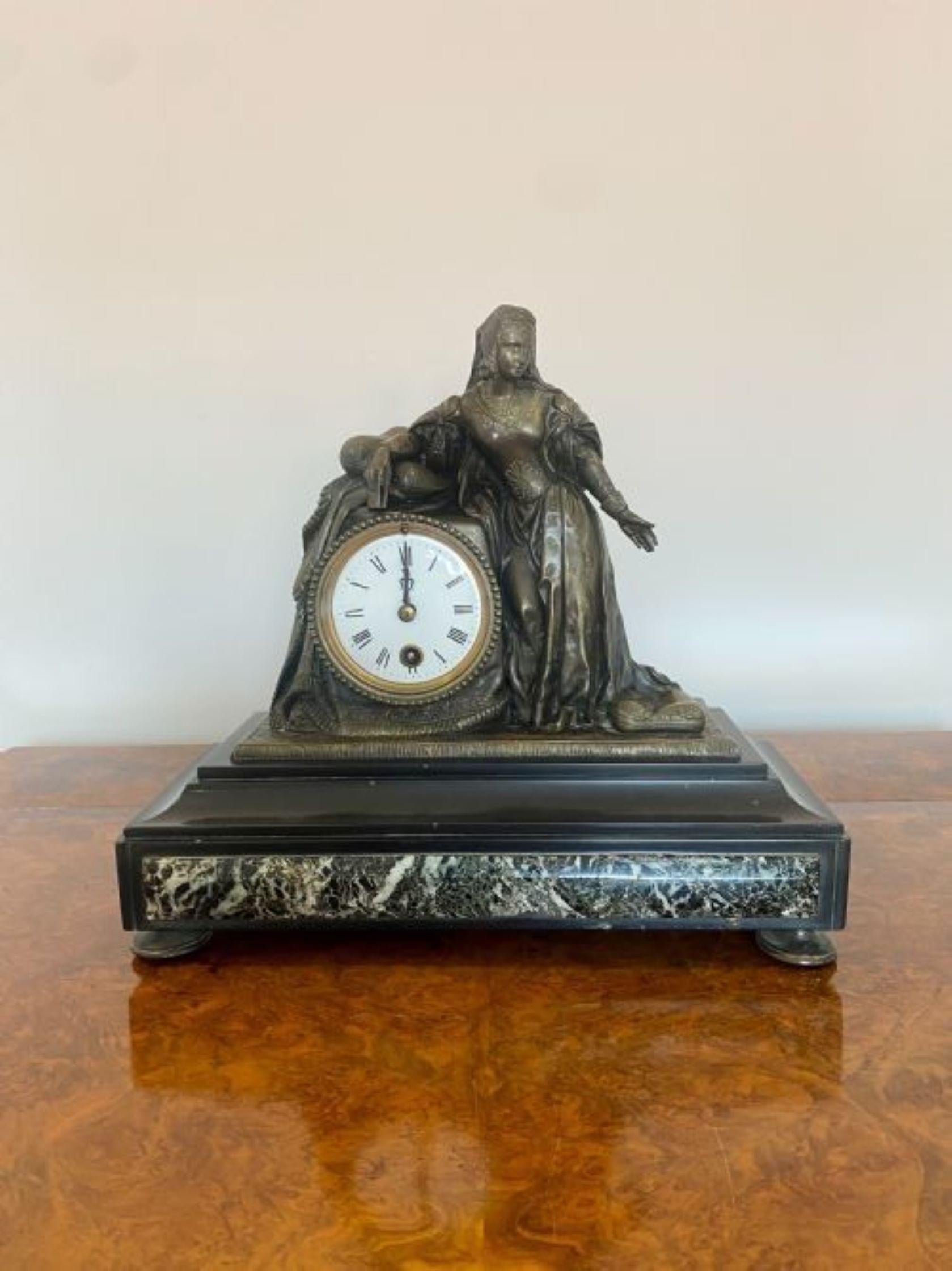 A quality Victorian Marble mantle clock with black Roman numerals with a white enamel face, the bronzed figural case surmounted by an Elizabeth maiden holding a book, on a stepped black slate and black and white marble plinth with original hands and