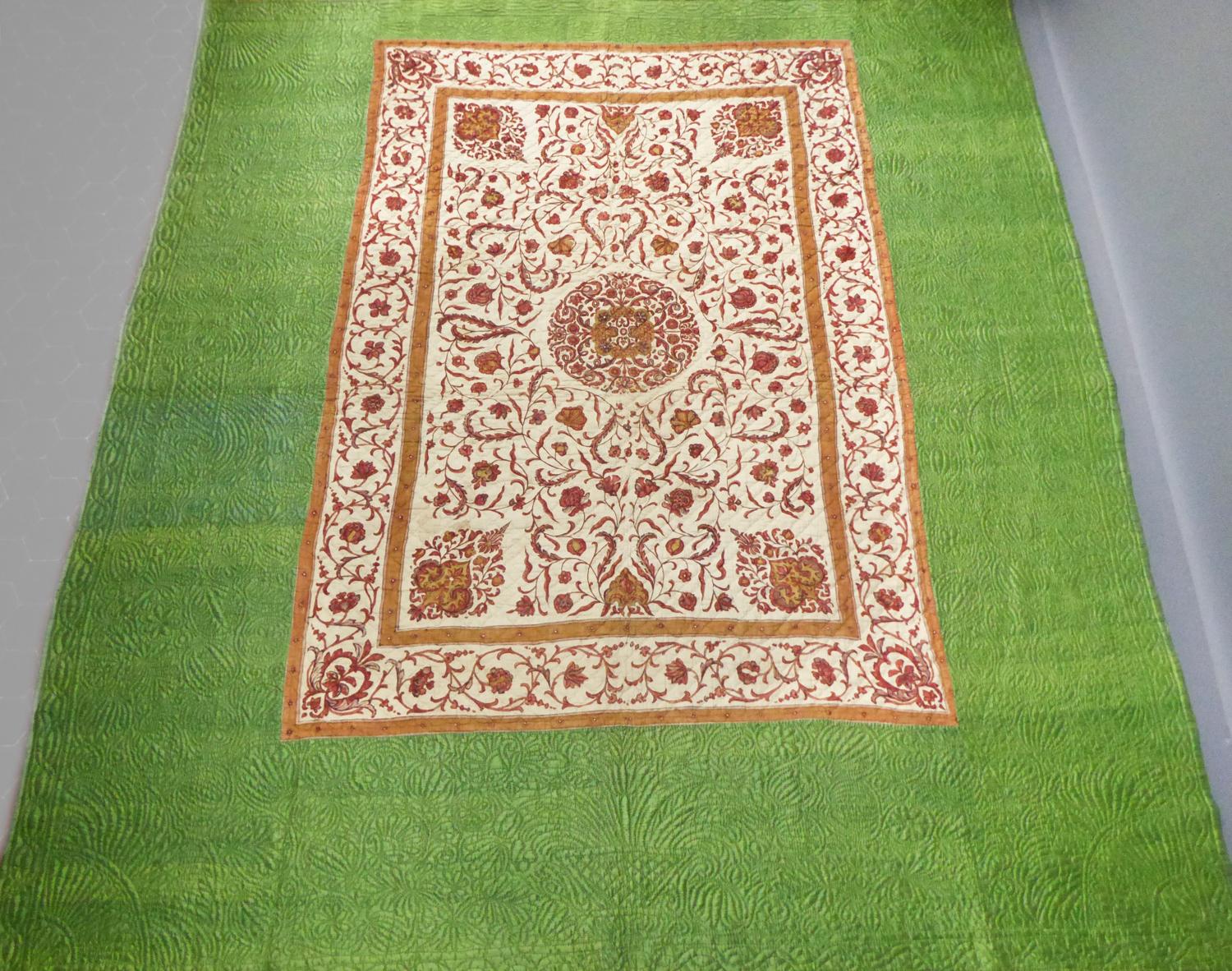 Circa 1720/1750
Coromandel Coast India for the Palampore 
France Provence for the quilting

A large quilted bedcover or hanging of an early printed indian Palampore surrounded by a green yellow taffeta silk of the same period. Orderly and
