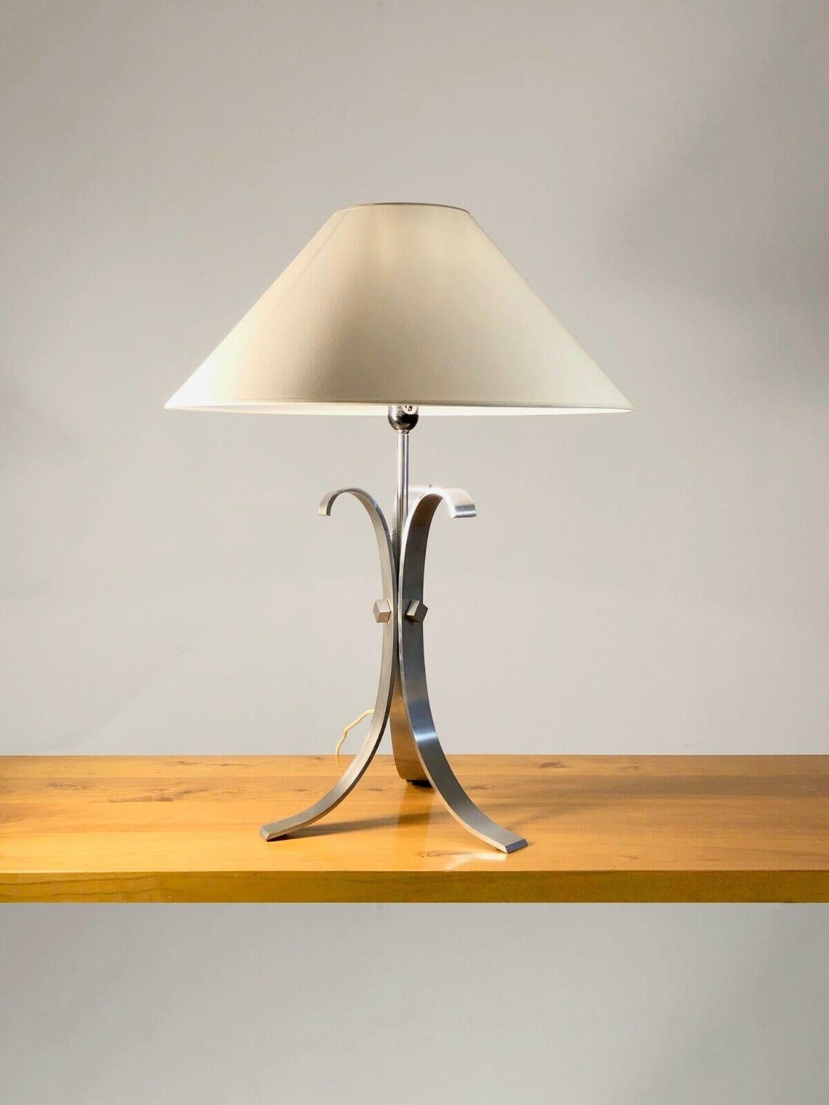 A radical and powerful tripod table lamp in the 