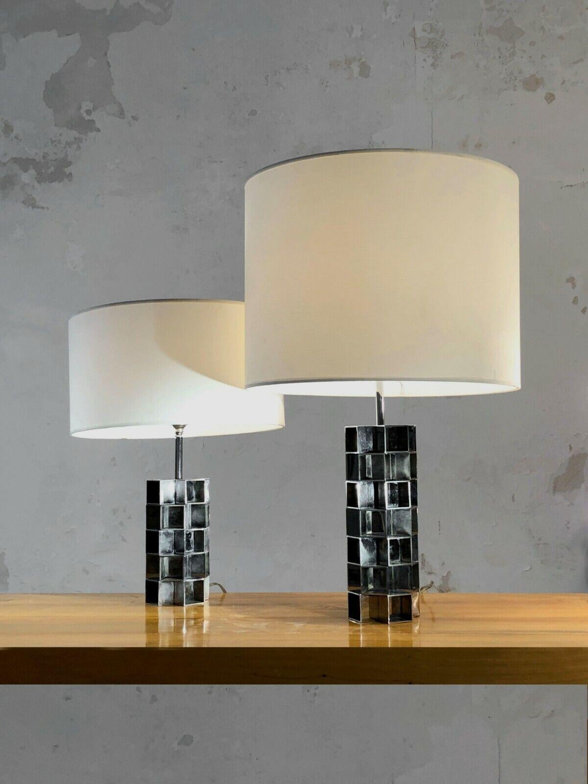 DESCRIPTION: An elegant and radical faux-pair (asymmetrical) of table lamps, Kinetic, Op-Art, Post-Modernist, Space-Age, hexagonal structure composed of a geometric accumulation of openwork cubes in nickel-plated bronze, each lamp being different