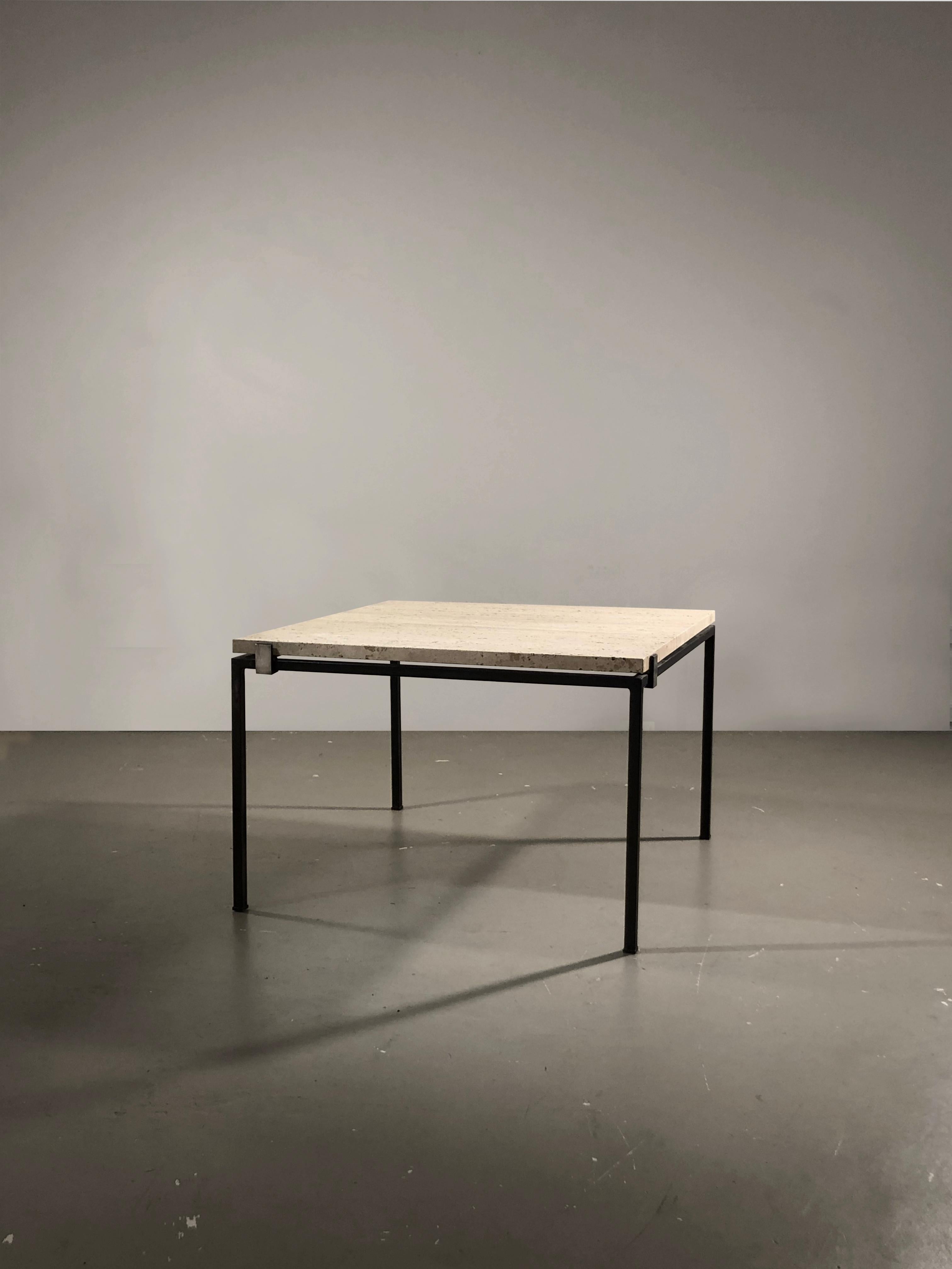 An elegant minimal and square rectangular coffee table, side table or night stand, Radical, Post-Modern, Architectural, black geometric structure made of square-section metal tubes, with massive travertine top, fixed over the structure by 4