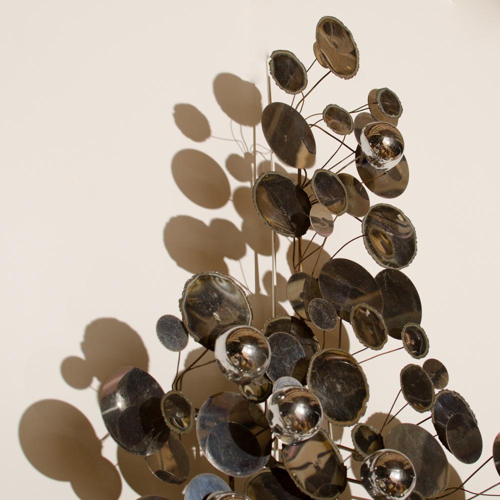 A raindrops sculpture designed by Curtis Jere for Artisan House. Polished and burnished chromed metal discs with various hues of patina. Signed by the artist, Circa 1960.
  