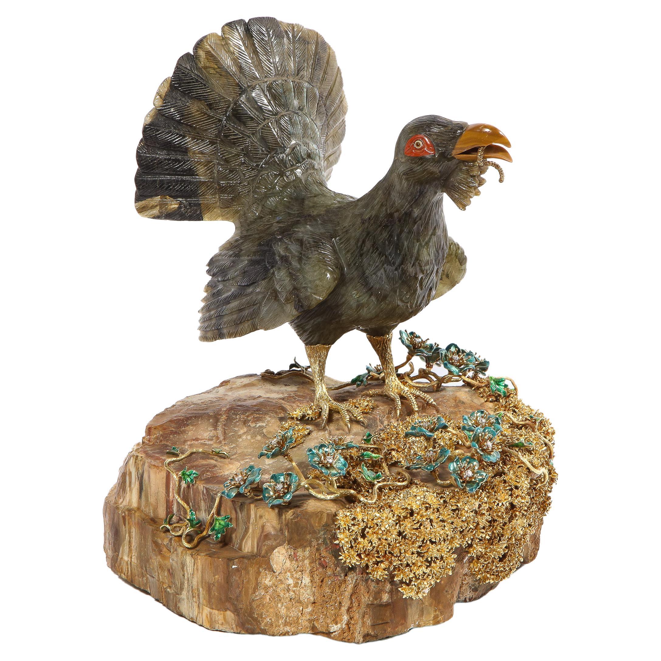A rare 18K gold, enamel and diamond mounted carved labradorite turkey / Capercaillie bird sculpture on a petrified wood base, attributed to Manfred Wild, Idar-Oberstein, Germany.

Very finely crafted of the highest quality and best color Madagascar