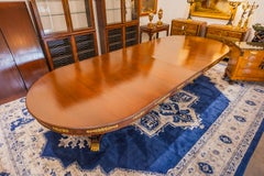 A rare 19th century French Empire gilt bronze mounted mahogany dining table