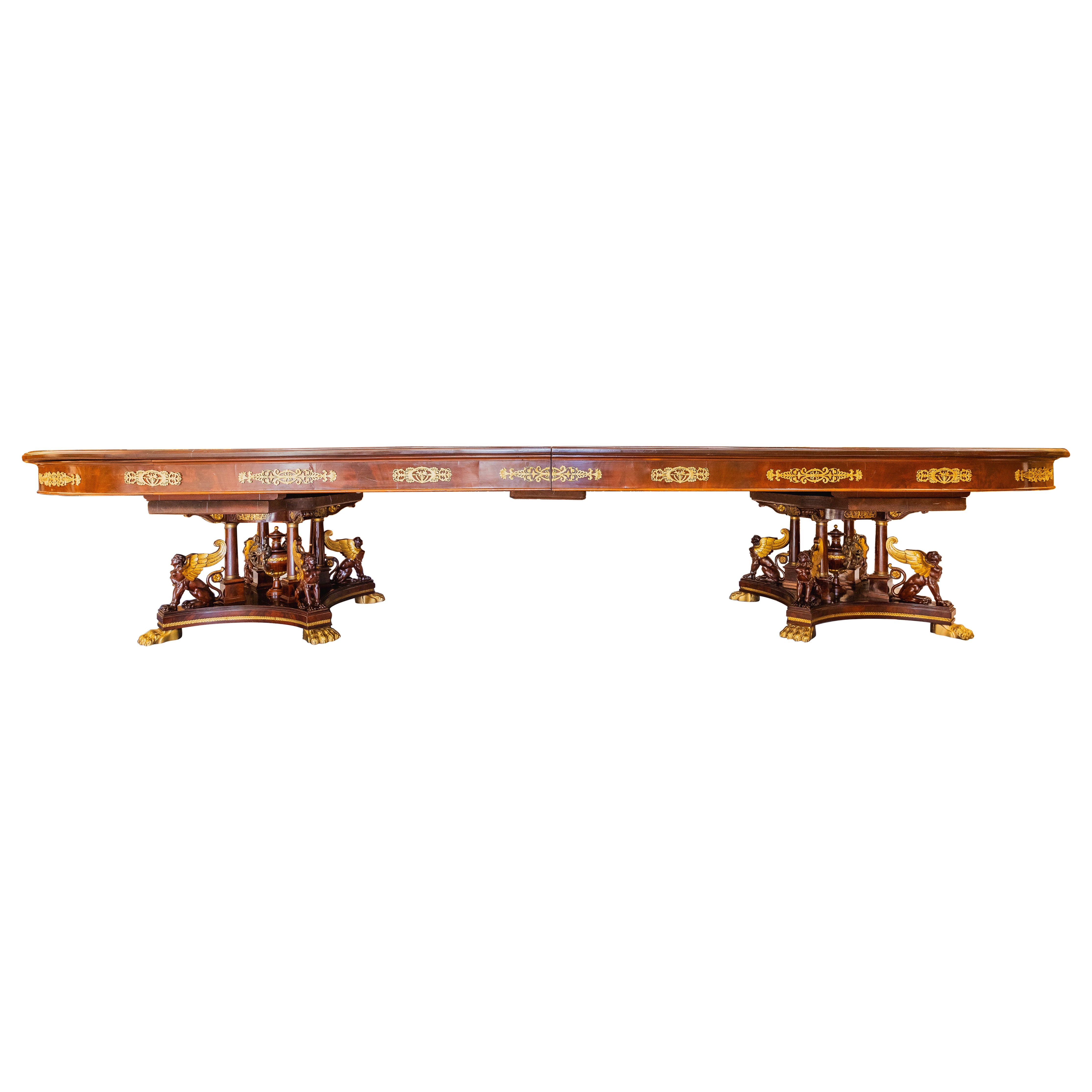A rare 19th century French Empire gilt bronze mounted mahogany dining table