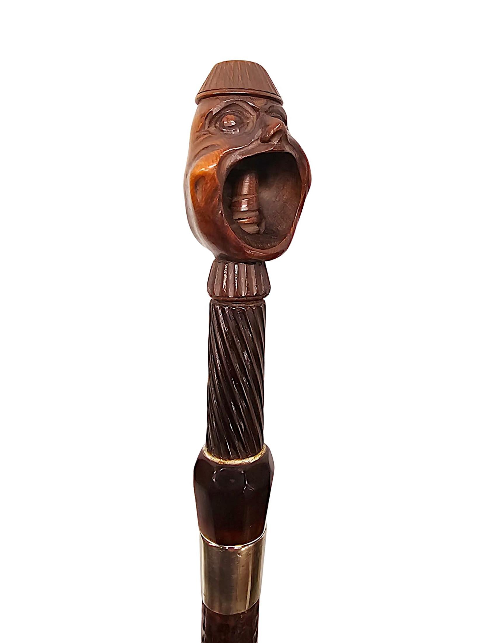 Rare canne casse-noix du 19e siècle avec une paire de têtes sculptées en vente 1