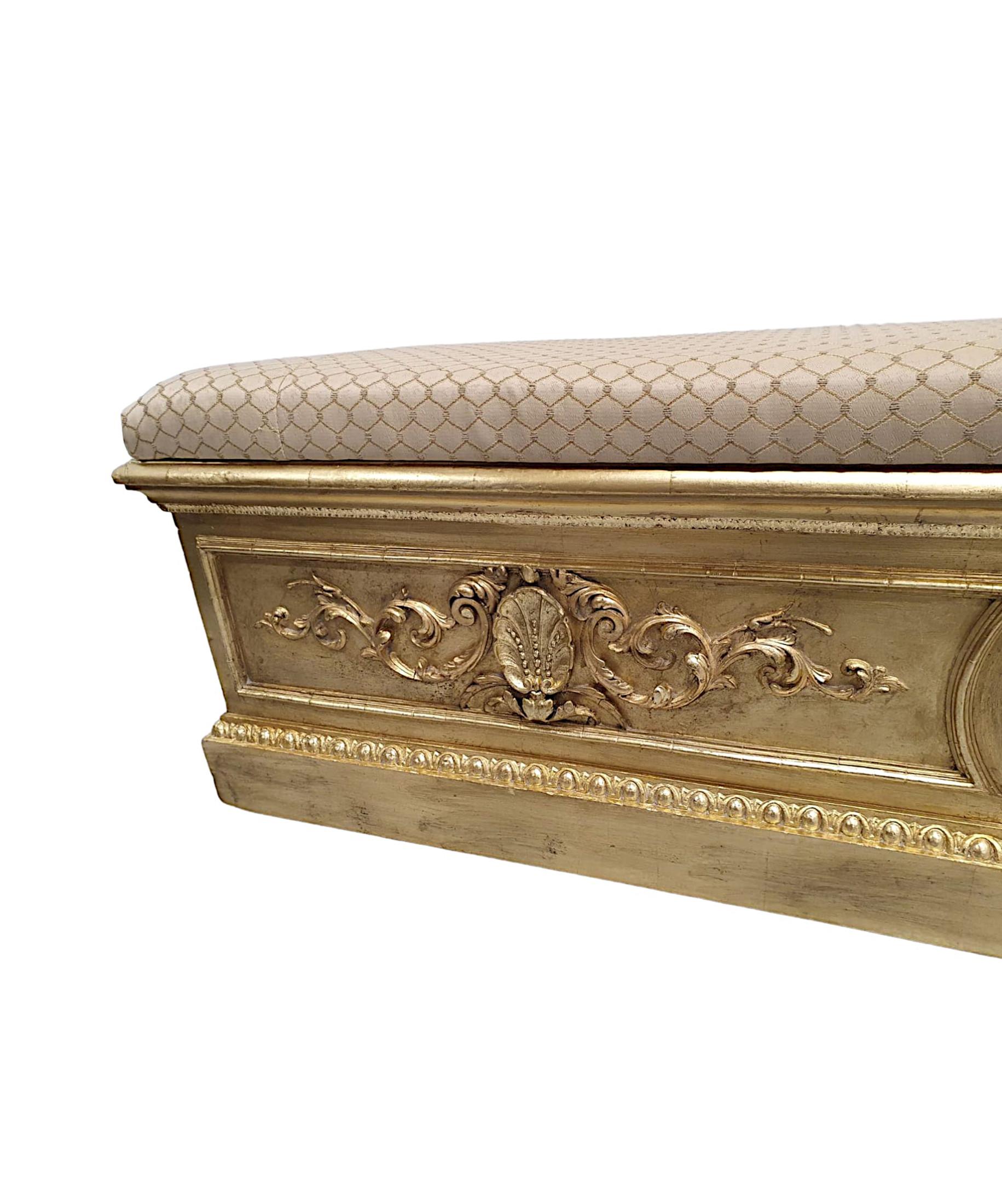 A very rare 19th Century giltwood Country House jardiniere converted to a long stool, fully restored, finely hand carved and of exceptional quality.  The gorgeous cushioned lift up seat of rectangular form is upholstered in a beautiful cream and