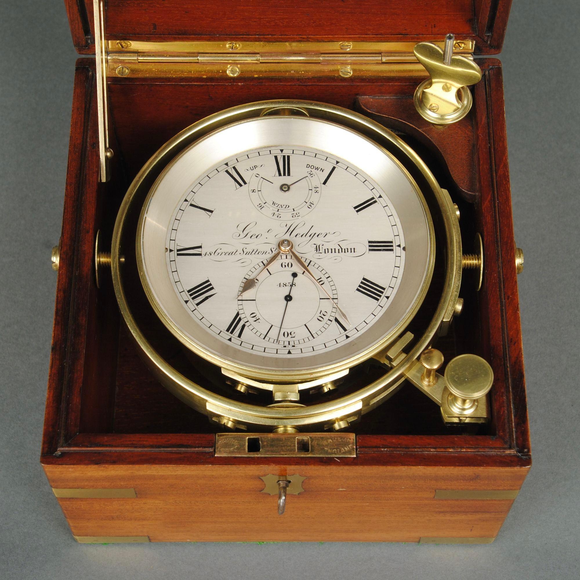 A fine example of a 2 day chronometer in the original 3 tier mahogany and brass bound case by William Hedger, the movement with the unusual layout is almost like an 8 day example made by Hedger himself who was a watch maker and worked at the address