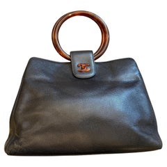 A Rare 2000s Black Caviar Leather and Bakelite Top Handle Bag By Chanel