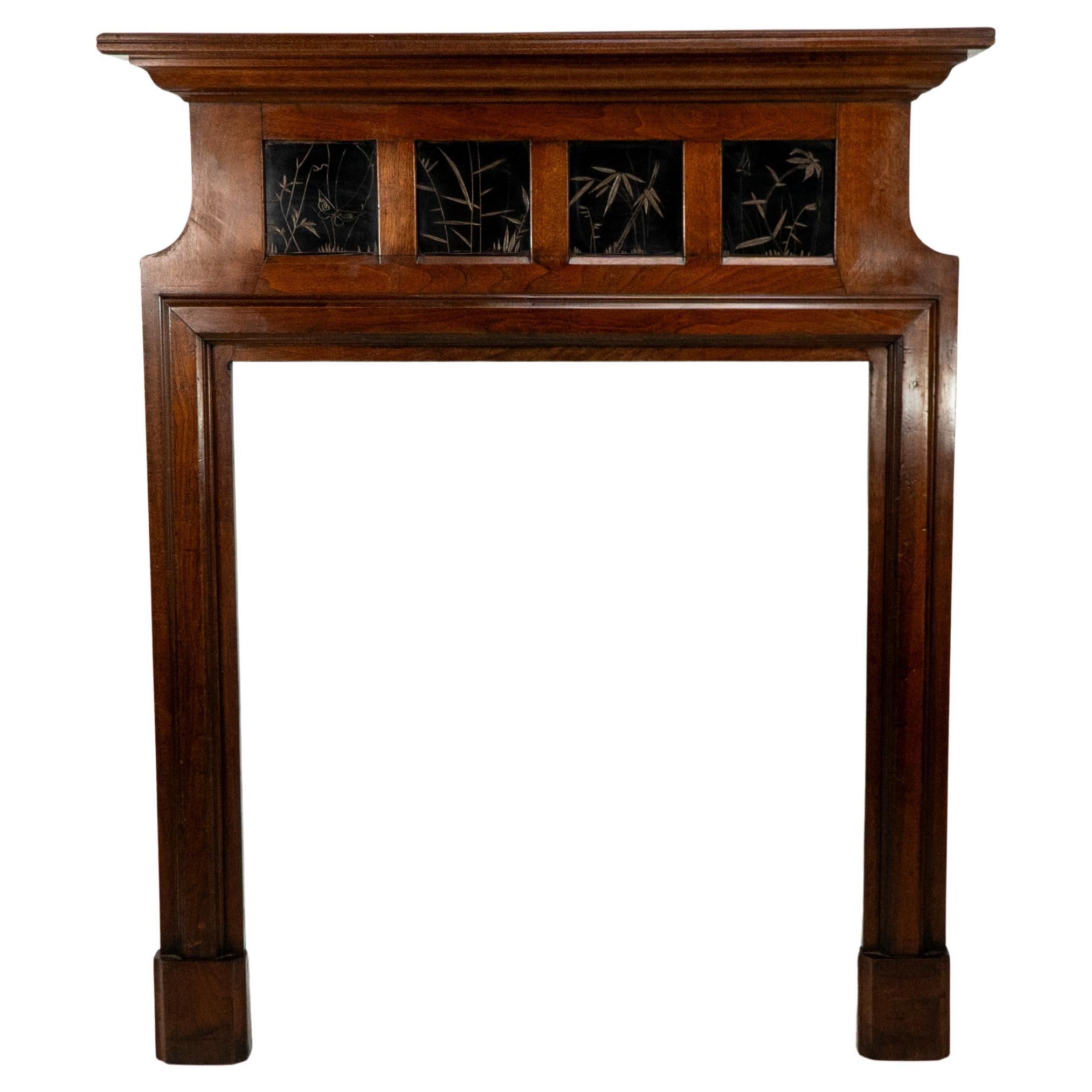 Thomas Jeckyll A rare Aesthetic Movement Walnut fire surround with butterfly's