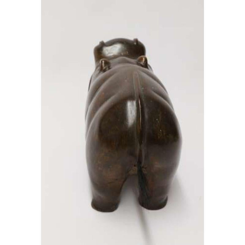 A rare African carved hardwood and bone study of a Hippopotamus.

This fabulous and amusing hand carved study of a hippopotamus originates from Africa and is primitively carved from a very heavy single block of dense rich red hardwood. It