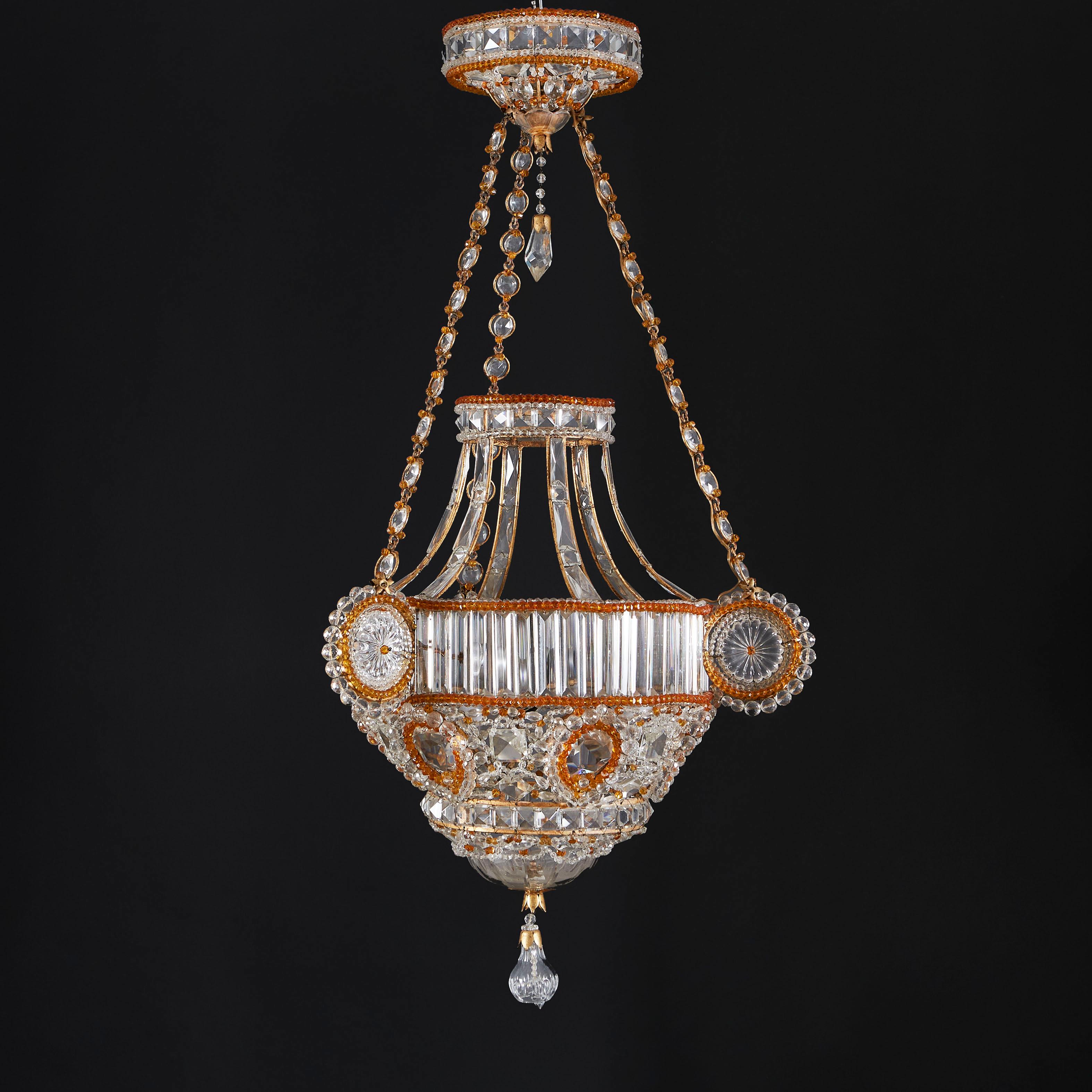 France, circa 1930.

An unusual early twentieth century hanging lantern decorated with amber glass and clear glass beads, with three exaggerated roundels and finely chased hanging chain. Attributed to Maison Bagues.

Height 108.00cm

Diameter 56.00cm