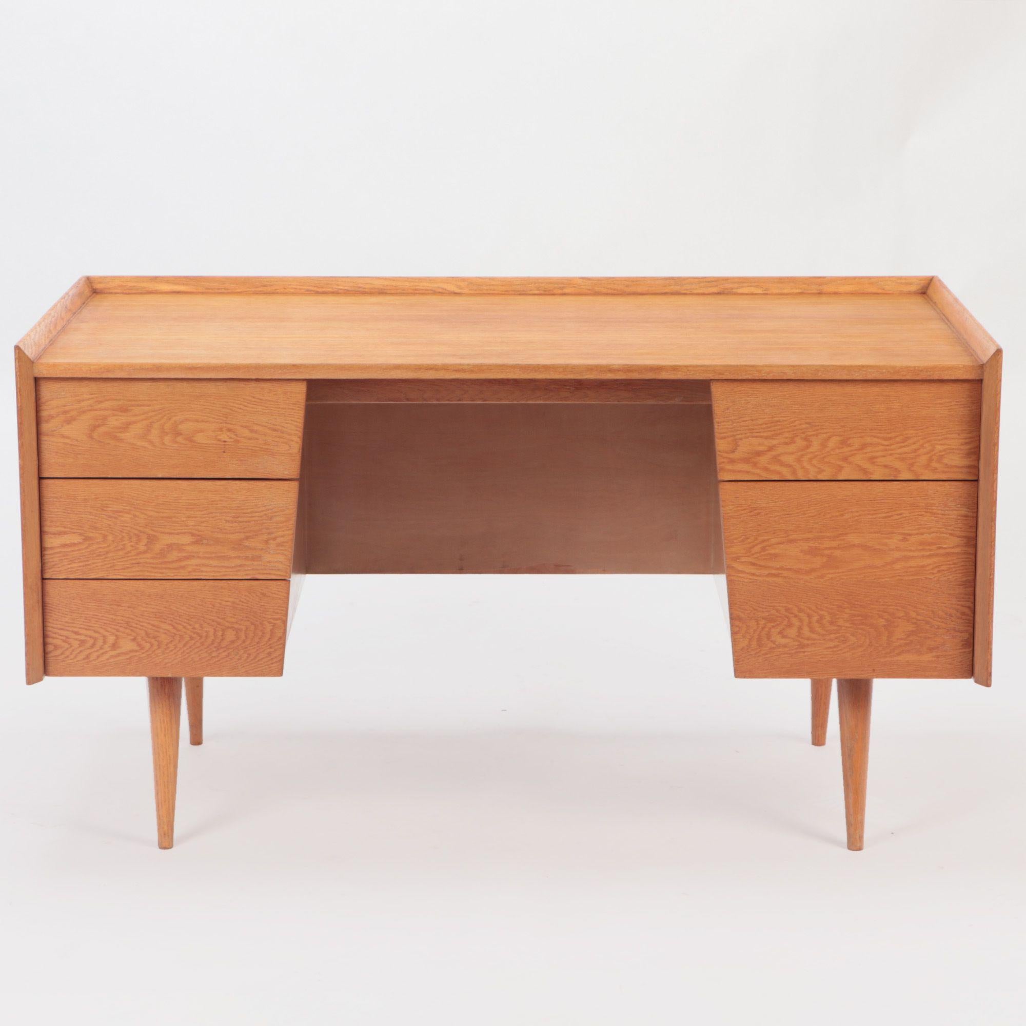 A rare and early white oak Mid-Century Modern five drawer desk labeled Risom Design circa 1950. Possibly from the early Risom NYC workshop.