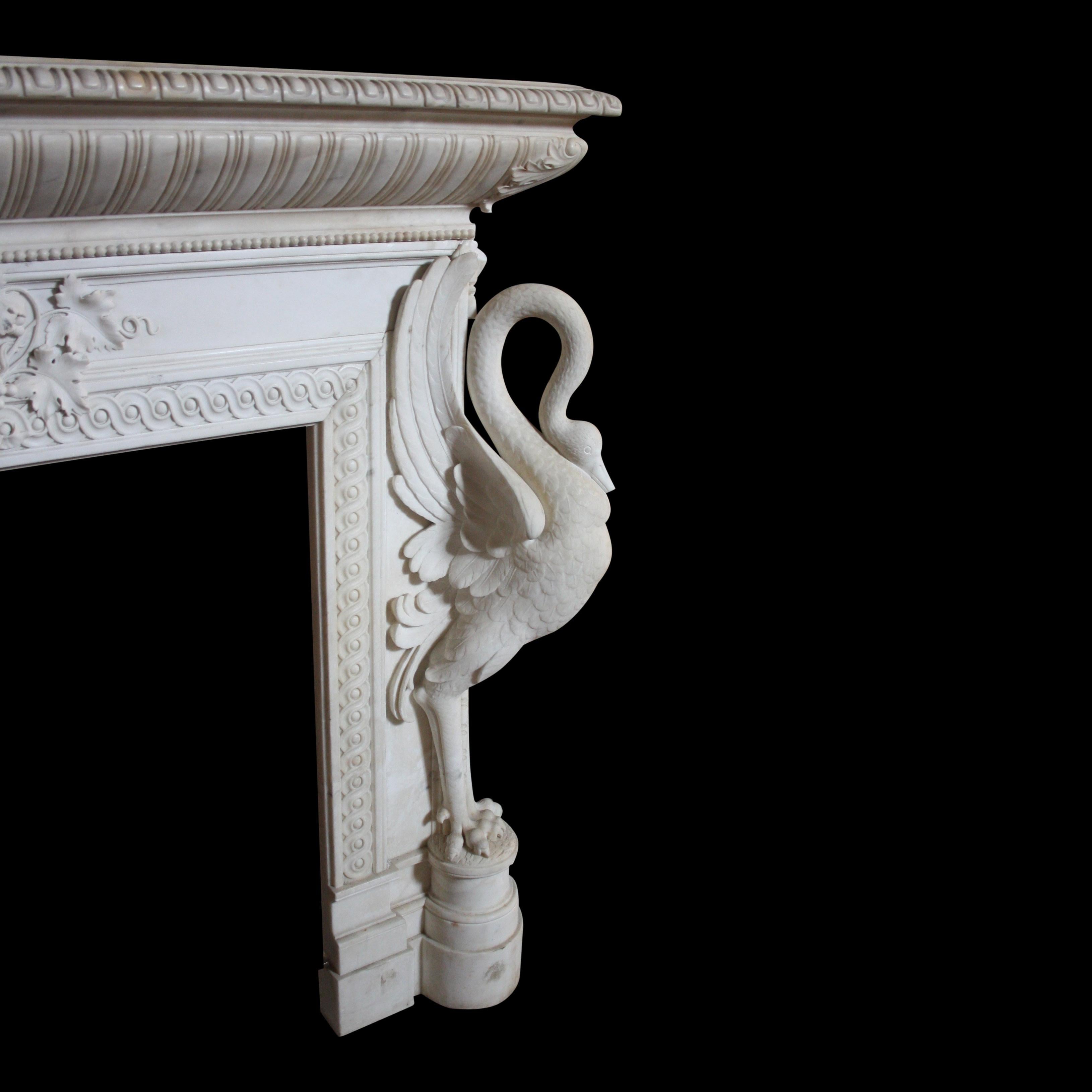 A rare and exceptional 19th century Italian Chimneypiece in Statuary marble.
The jambs are in the form of stylised cranes, standing on circular plinth blocks. Their wings are thrusting upwards, whilst their sinuous necks curl softly down onto their