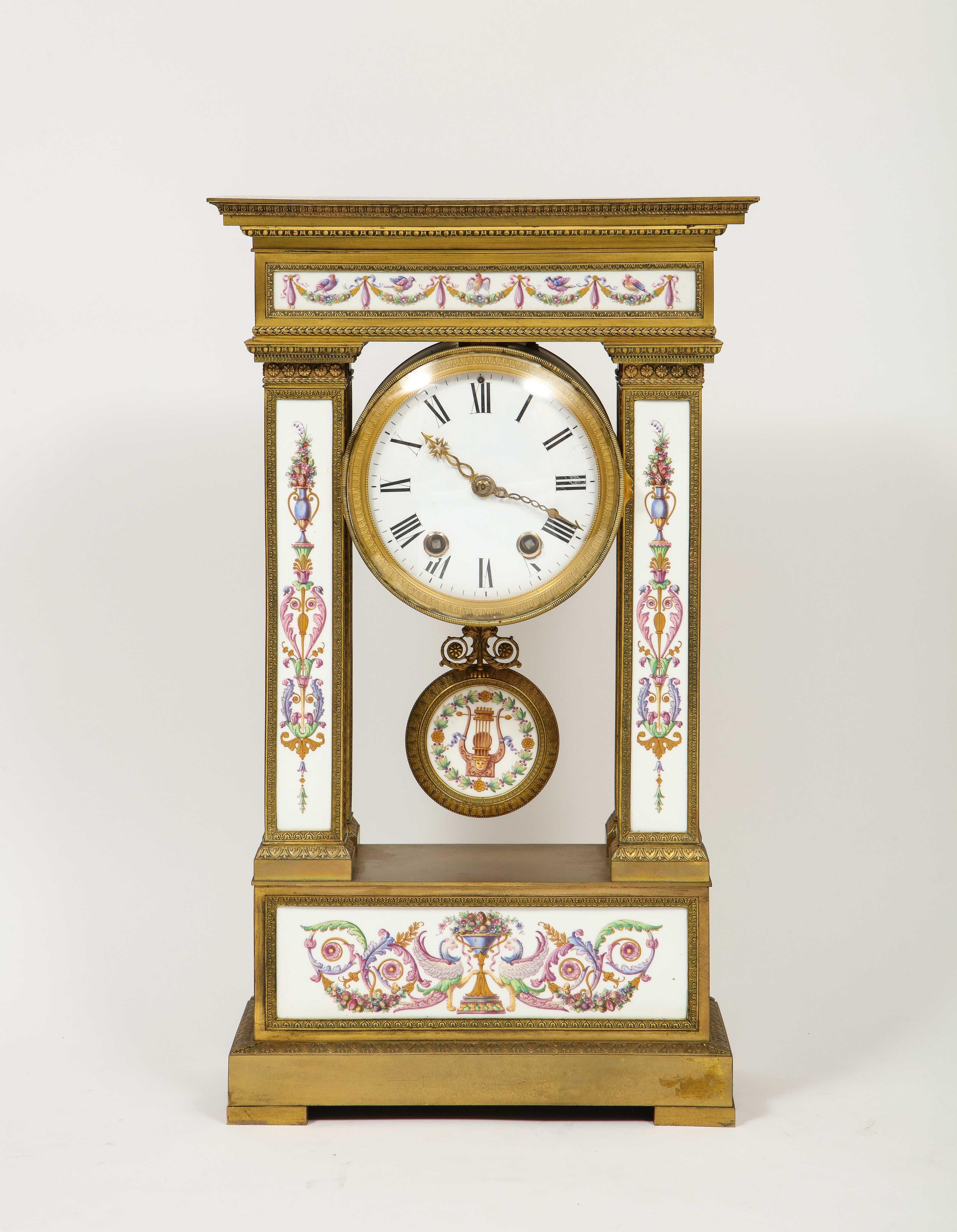 A Rare and Exquisite French Ormolu Bronze and Porcelain Clock, attributed to Jean Francois Deniere, 
circa 1810.

This large and elaborate clock is made of the finest quality ormolu and porcelain during the period. Of rectangular form, with
