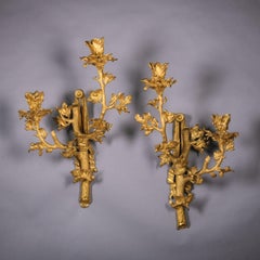 A Rare and Highly Unusual Pair of Gilt-Bronze Twin-Light Wall Appliques
