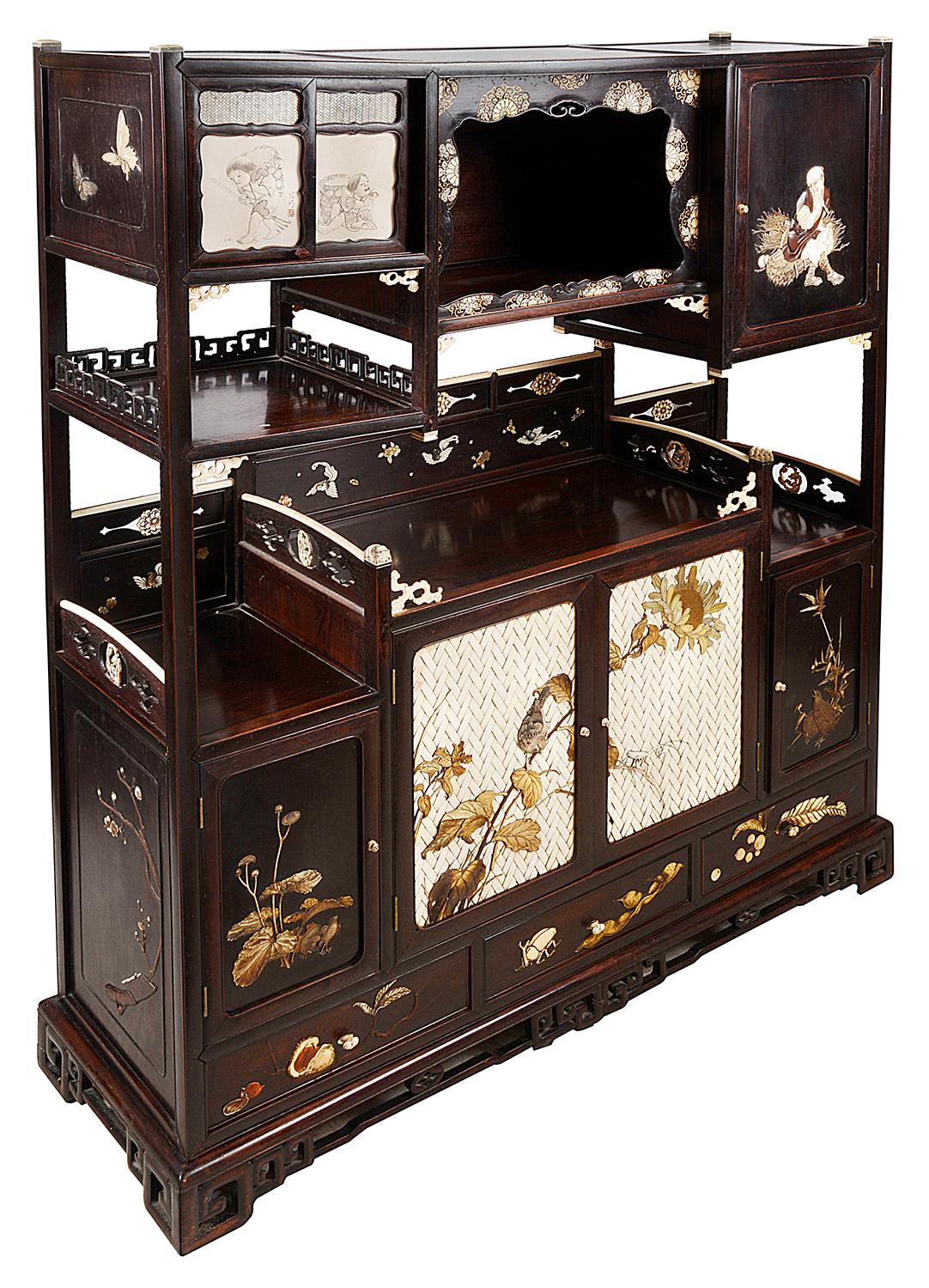 A Japanese hardwood shodana with inlaid and lacquer decoration, Meiji Period 1868-1912, by Shoso Kosen, bearing two character signature and red seal, with various shelves, cupboards, recesses and drawers inlaid in ivory, bone, mother of pearl and