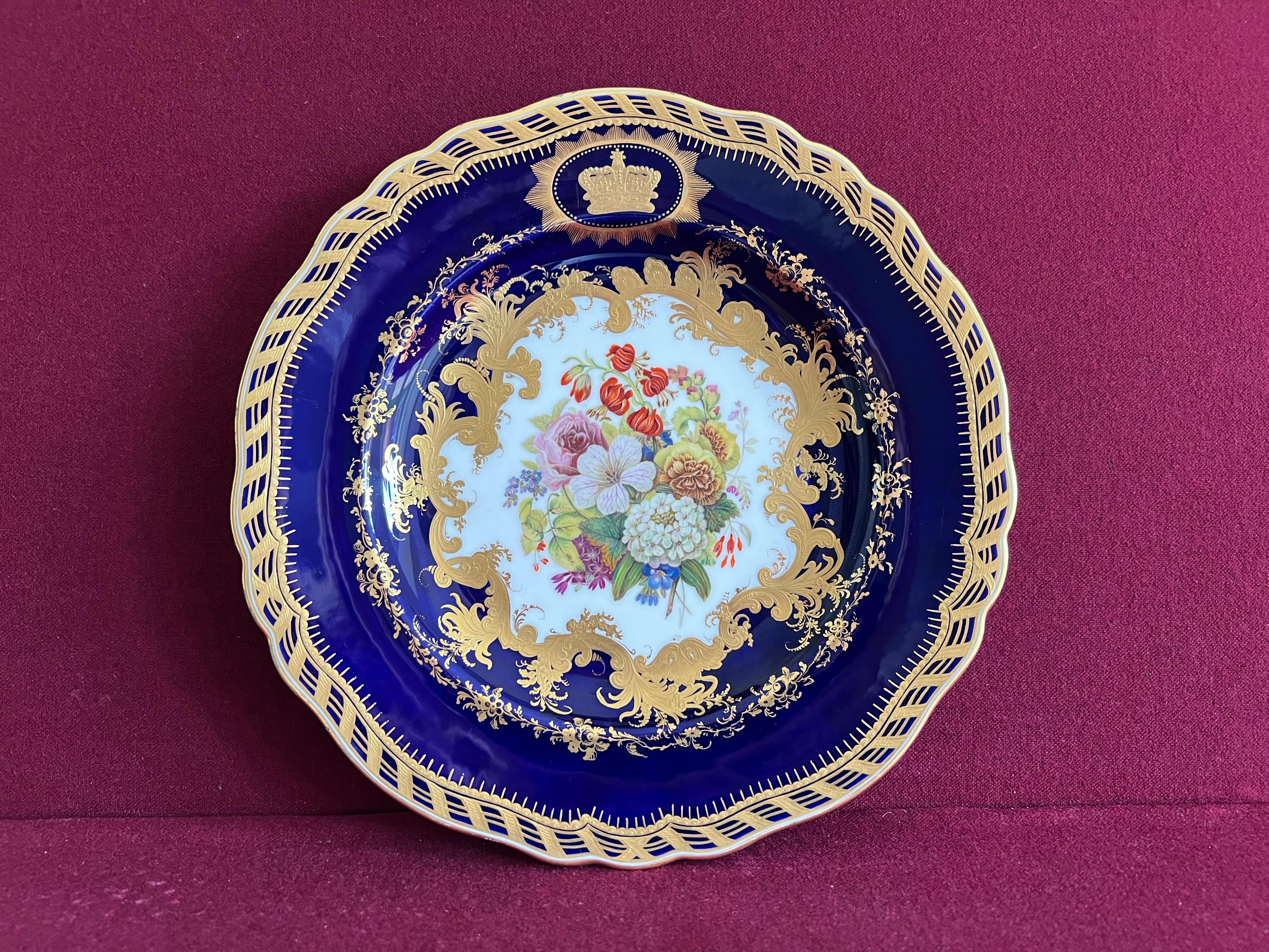 A rare and possibly unique Ridgway Royal Porcelain plate c.1850. The central reserve very finely decorated with a bouquet of flowers, the border decorated with a deep cobalt blue ground and finely tooled paste gilding with the Royal Crown within a