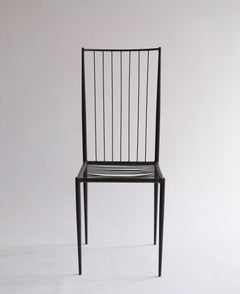 A rare and sculptural side chair by Philolaos Tloupas, executed in lacquered iro