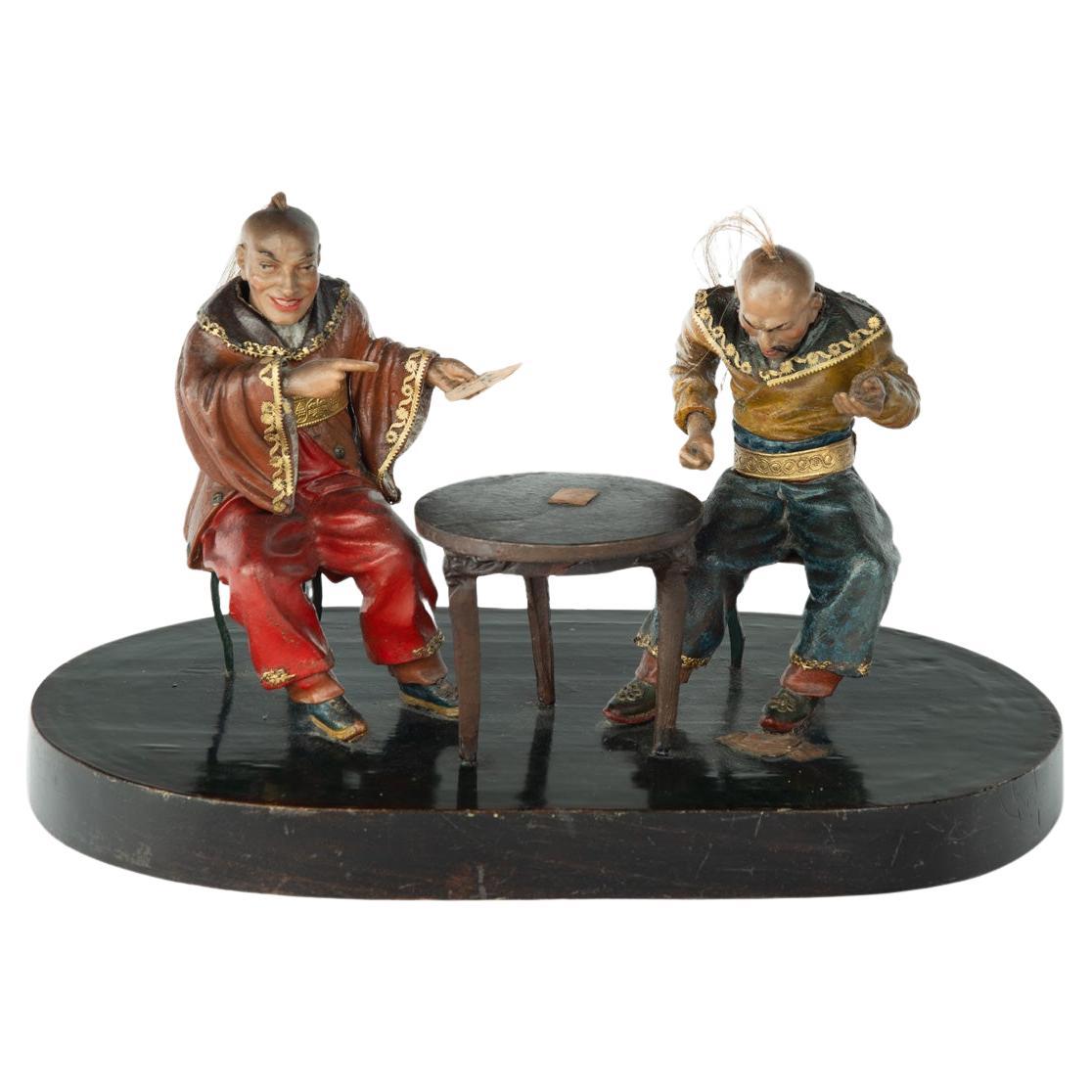 A rare Anglo-Chinese Regency polychrome painted wax and wood group of two Chines For Sale
