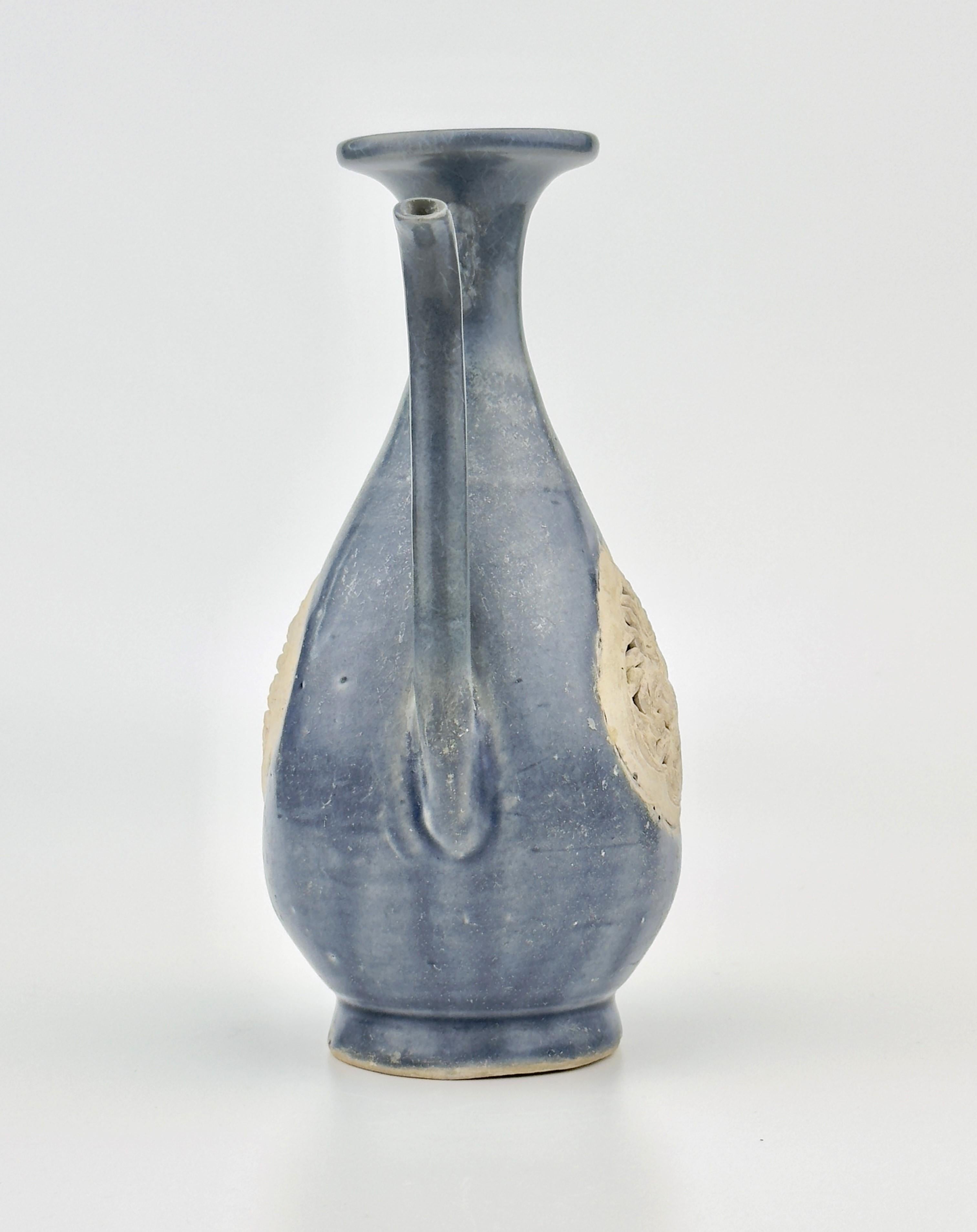 Stoneware painted with underglaze cobalt blue and remnants of overglaze enamel.

Year/Period : 15th century
Region : North Vietnam
Type : Ewer
Found/Acquired : Southeast Asia , South China Sea, Hoi An Ship
Reference : 
1) Phoenix Art Museum - OBJECT