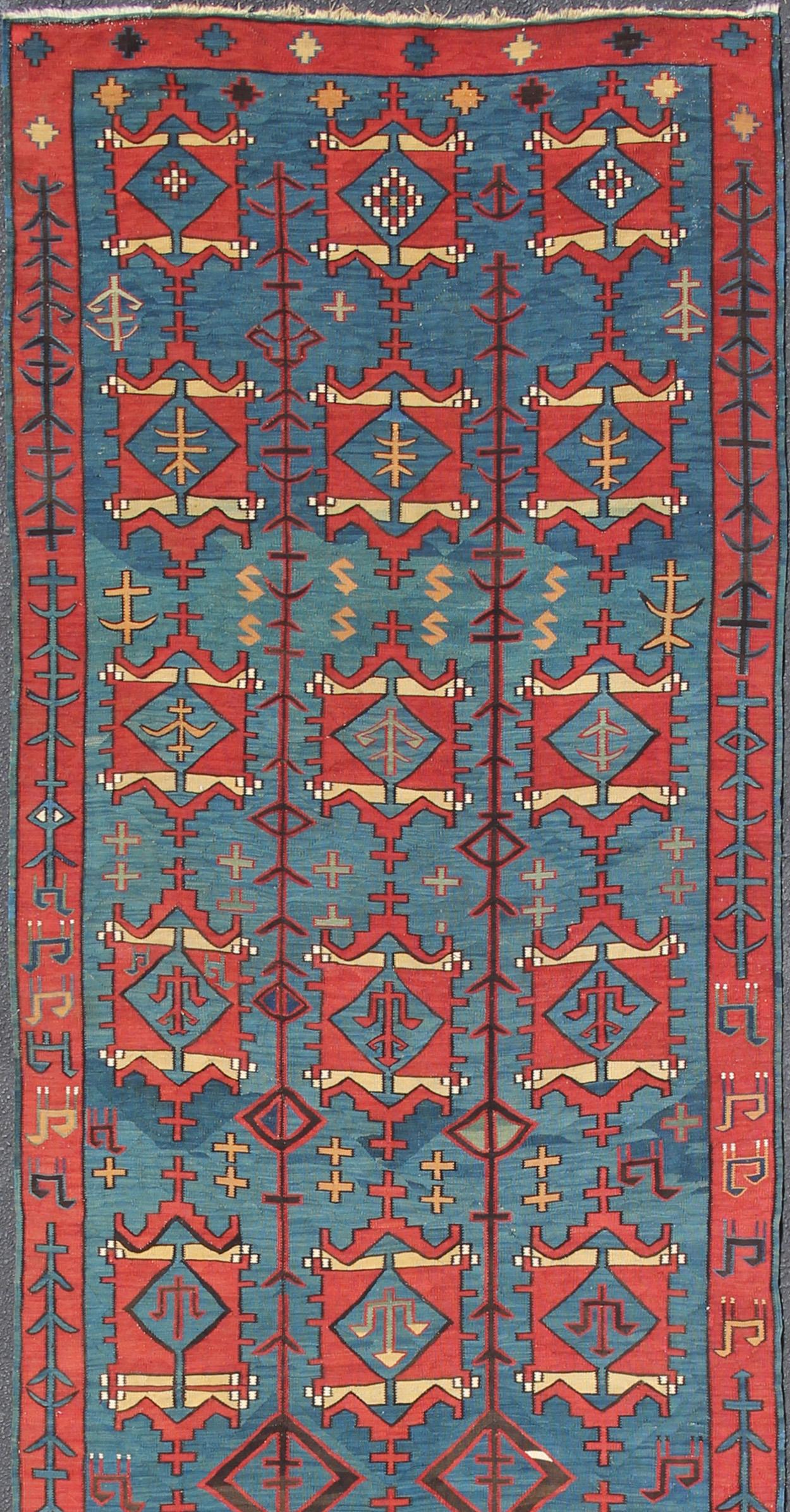 Amazing and rare antique Caucasian Avar tribal flat-weave Gallery size in blue and red, tribal Caucasian Kilim rug with all-over diamond and geometric design, rug R20-0301, country of origin / type: Caucasus / Kilim, circa 1900, Avar Caucasian,