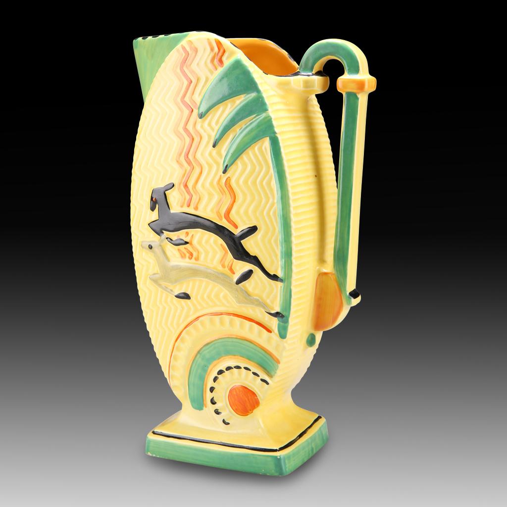 A Rare & Beautiful 1930s Vintage Art Deco Jug by Burleigh Ware

This is a rare and beautiful Art Deco Jug by Burleigh Ware that dates back to the 1930s. In shades and varying depths of cream and green with orange tones and two leaping gazelles in