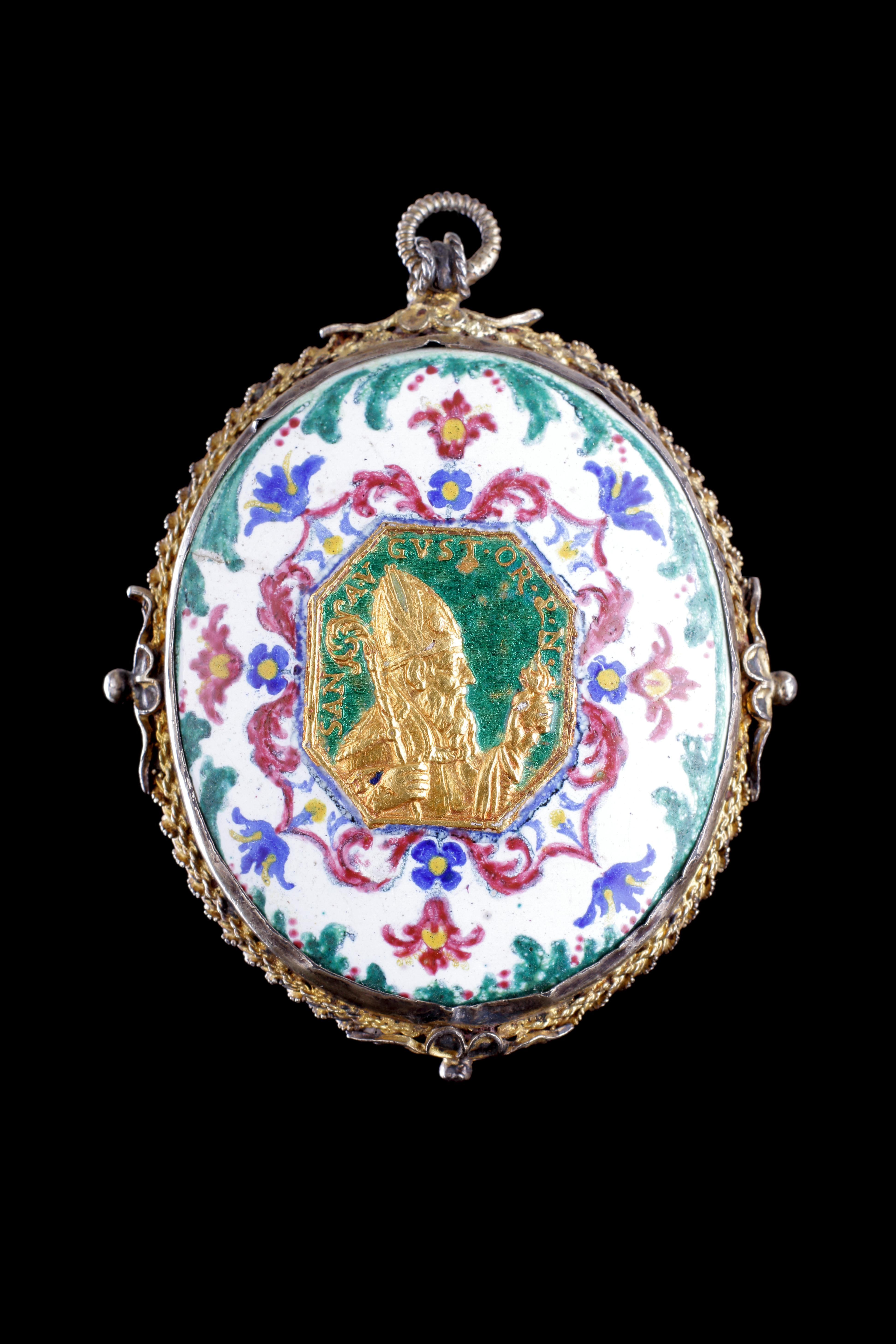 A Rare Berlin Silver Gilt Mounted Rock Crystal and Enamel Pendant 
With a wax ‘Agnus Dei’ oval relief to the reverse
Dated 1734 
Attributed to the Fromery workshop (Berlin 1685 - 1738) 
Copper, Enamel, Silver, Gilt, Wax, Rock Crystal 
German
18th