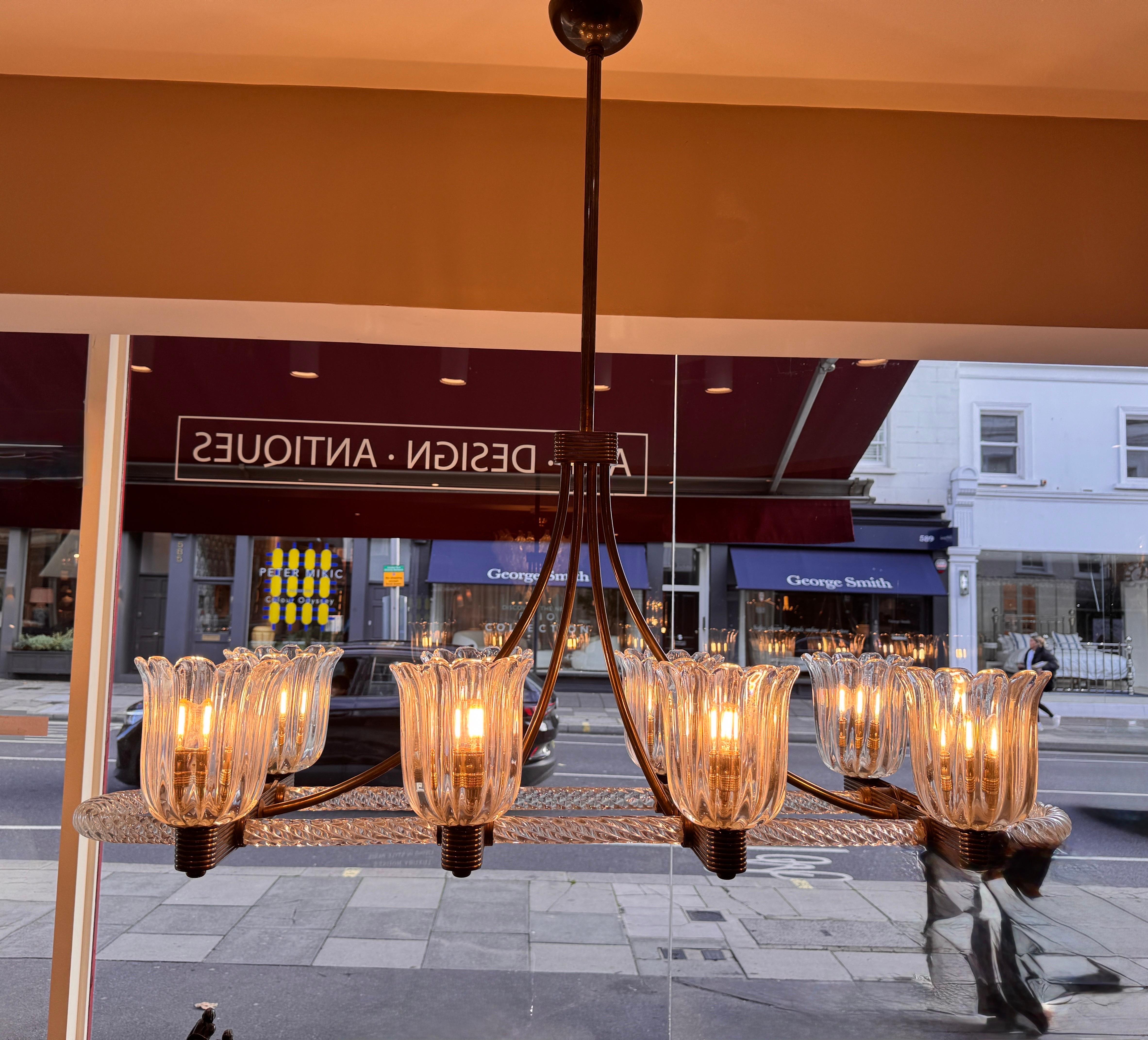 Italian A rare brass mounted 8 arms horizontal chandelier by Ercole Barovier For Sale