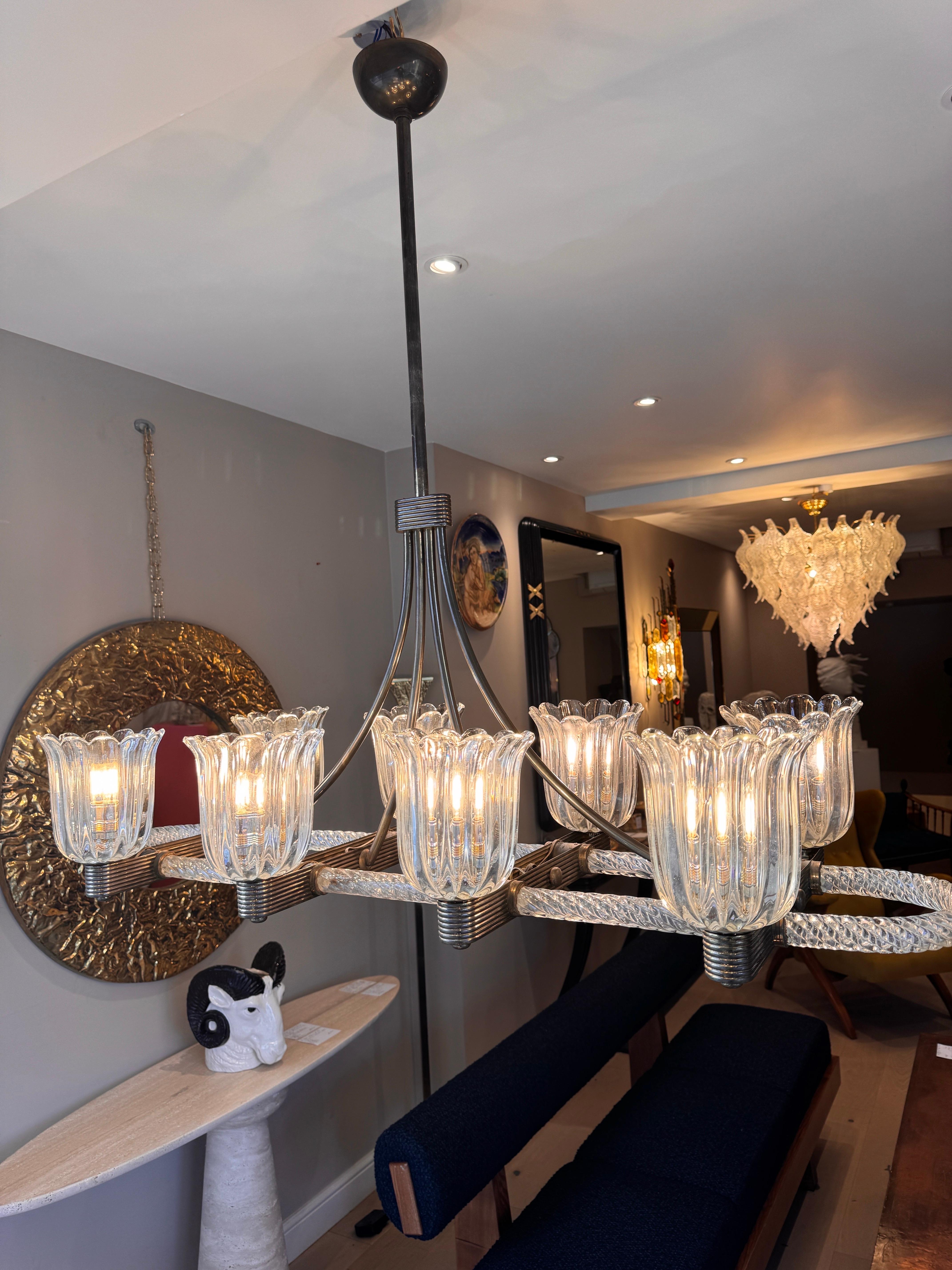A rare brass mounted 8 arms horizontal chandelier by Ercole Barovier In Good Condition For Sale In London, GB