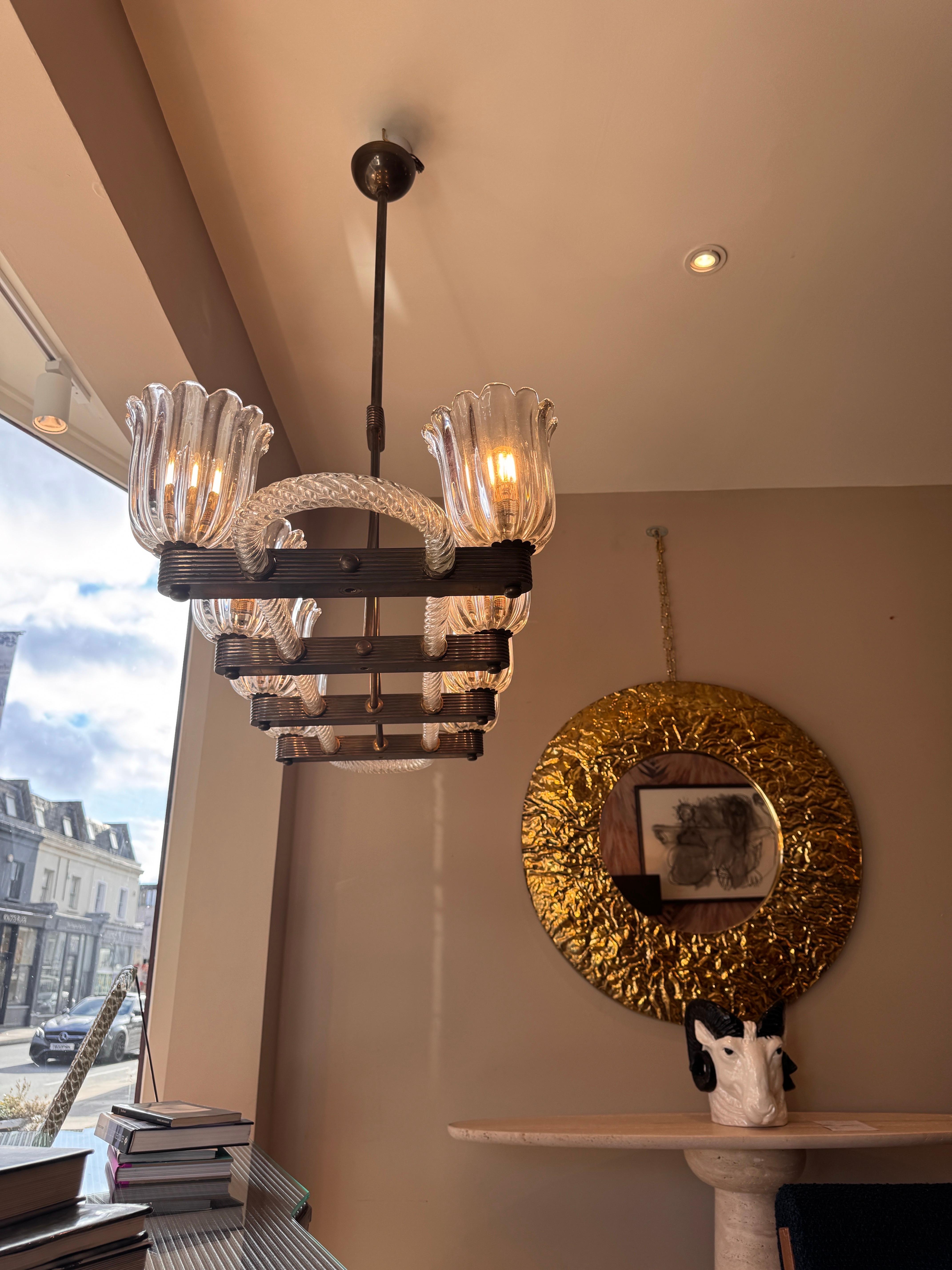 Brass A rare brass mounted 8 arms horizontal chandelier by Ercole Barovier For Sale