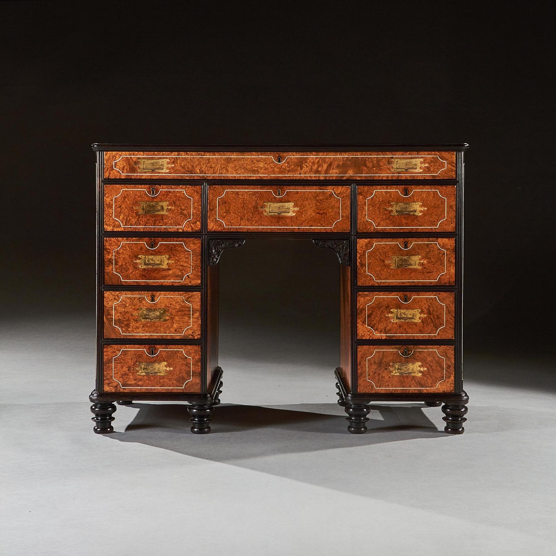 Rare and outstanding example of an early 19th century Anglo-Chinese export amboyna and ebony campaign kneehole desk retaining the original patina with wonderful colour. 



China circa 1830



One of the finest examples you will see,