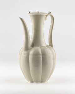 A Rare Cream-Glazed Ding yao Ewer and Cover, Five Dynasties/Song Dynasty