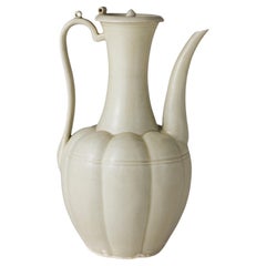 A Rare Cream-Glazed Ding yao Ewer and Cover, Five Dynasties/Song Dynasty